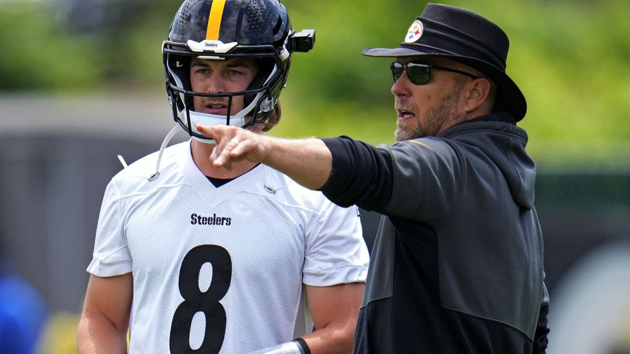 Pittsburgh Steelers quarterback Kenny Pickett, left, listens to offensive coordinator Matt Canada during the first day of the NFL football team's minicamp, in Pittsburgh on Tuesday, June 13, 2023.