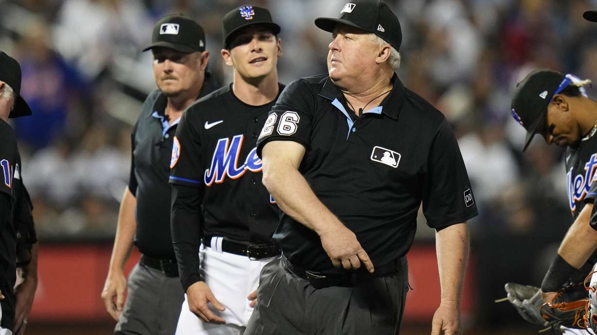 Umpire Bill Miller, right, ejects New York Mets relief pitcher Drew Smith, center, during the seventh inning of a baseball game against the New York Yankees Tuesday, June 13, 2023, in New York.
