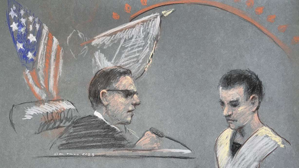 Massachusetts Air National Guardsman Jack Teixeira, right, appears in U.S. District Court in Boston, Friday. He has been formally indicted on six counts of willful retention and transmission of classified information.