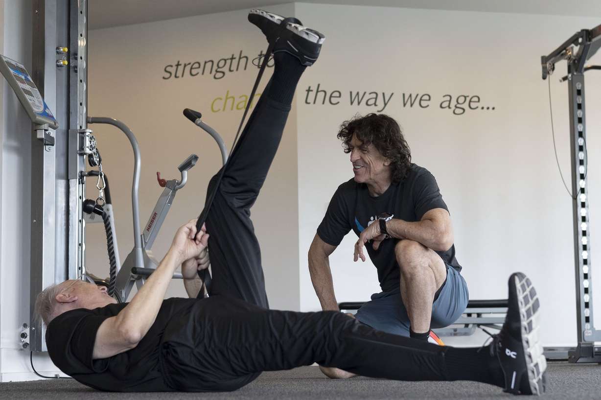 Rich McKeown, 76, works out with Paul Holbrook at Age Performance in Salt Lake City on Wednesday.