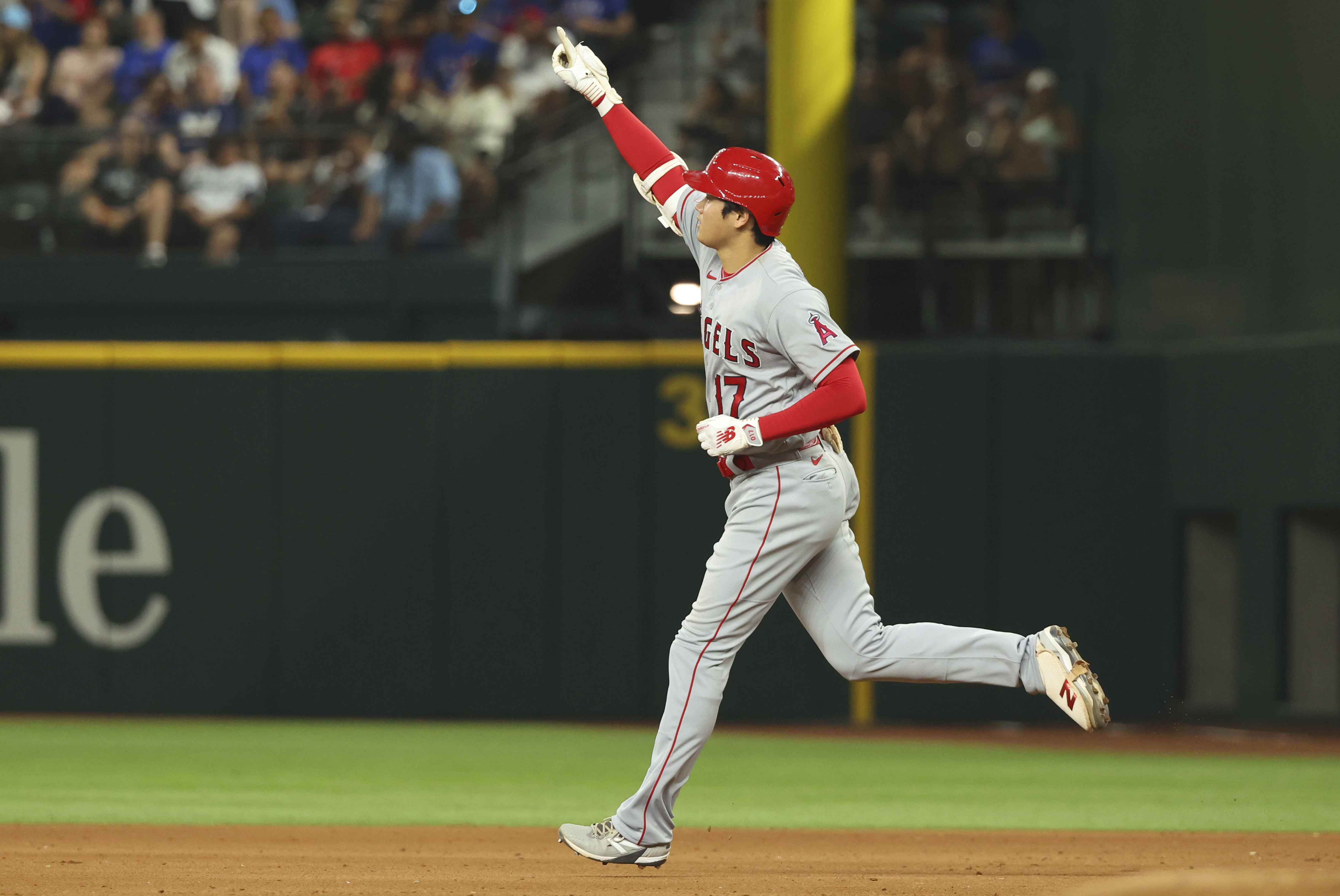 Los Angeles Angels' Shohei Ohtani runs the bases after hitting a two-run home run in the eighth inning in a baseball game against the Texas Rangers, Thursday, June 15, 2023, in Arlington, Texas. 