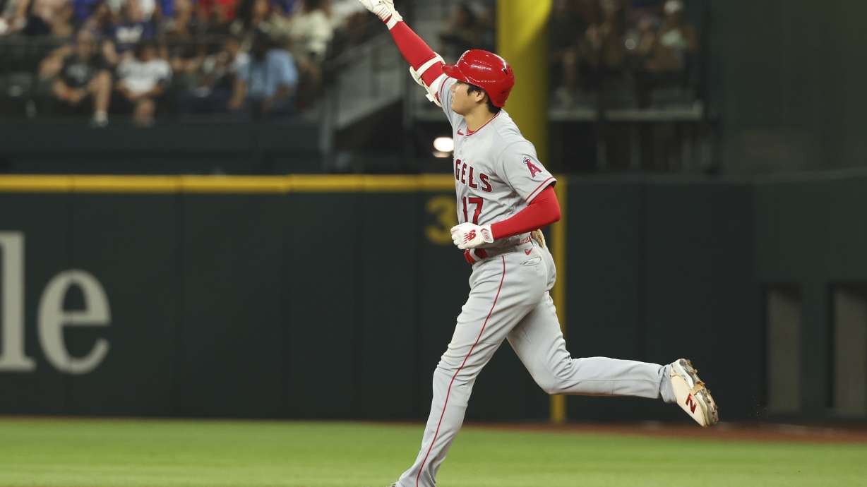 Los Angeles Angels' Shohei Ohtani runs the bases after hitting a two-run home run in the eighth inning in a baseball game against the Texas Rangers, Thursday, June 15, 2023, in Arlington, Texas.