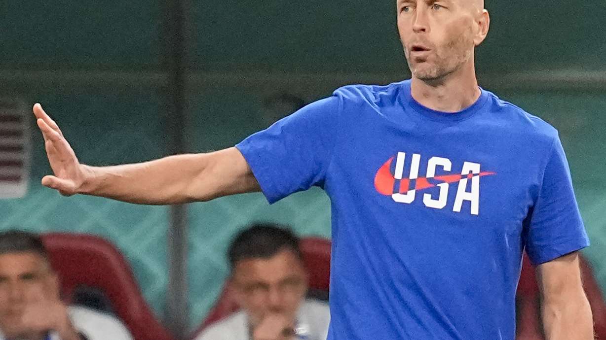 FILE - U.S. coach Gregg Berhalter gestures during the team's World Cup round of 16 soccer match against the Netherlands at Khalifa International Stadium in Doha, Qatar, Dec. 3, 2022. Berhalter has agreed to return as U.S. coach after being cleared in a domestic violence investigation, a person familiar with the decision told The Associated Press. The person spoke on condition of anonymity Thursday night, June 15, because an announcement had not been made.