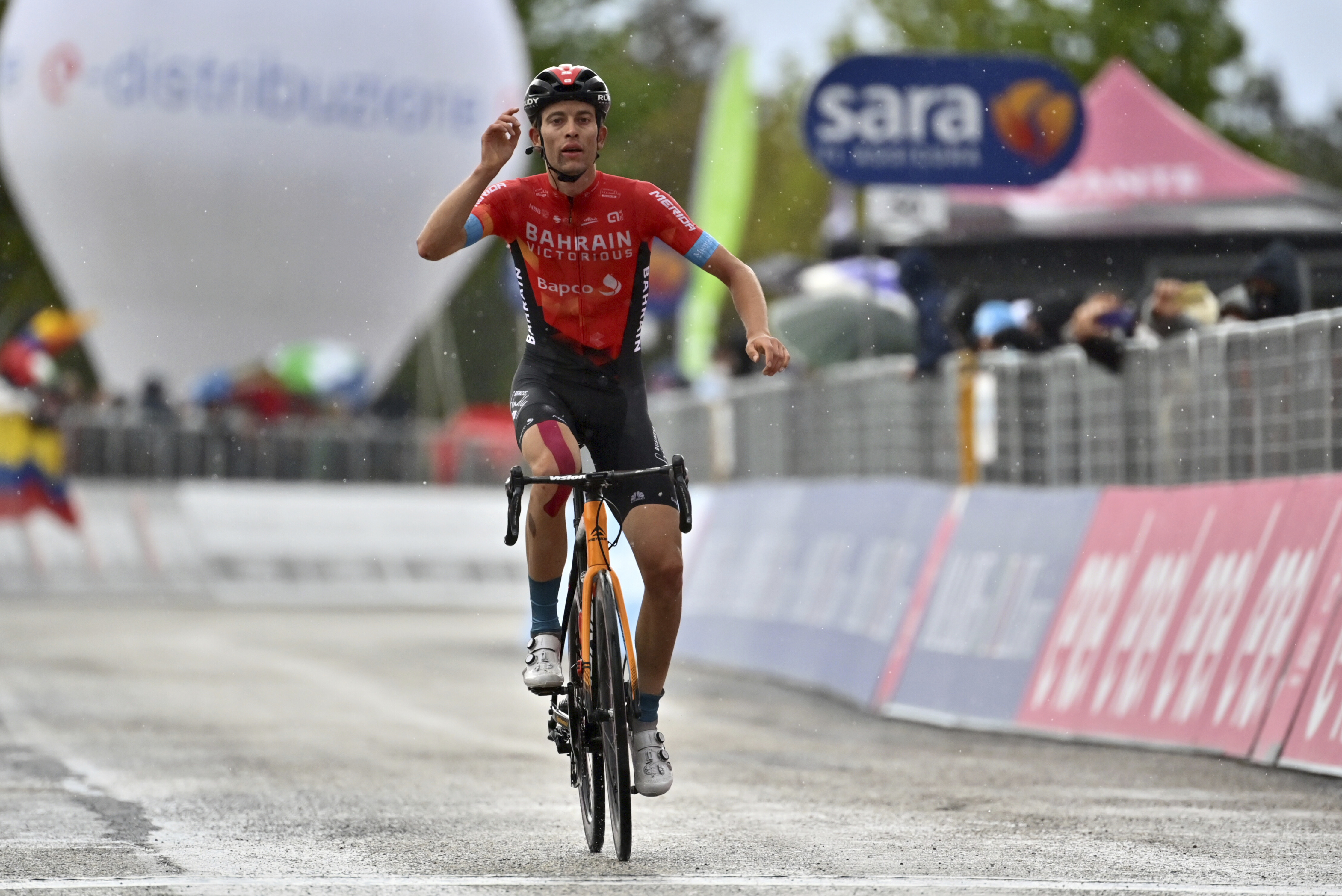 FILE - Switzerland's Gino Mader celebrates after winning the sixth stage of the Giro d'Italia cycling race, from Grotte di Frasassi to Ascoli Piceno Thursday, May 13, 2021. Swiss cyclist Gino Mader has died Friday, June 16, 2023 one day after suffering injuries when he crashed off the road down a ravine during a descent at the Tour de Suisse. 