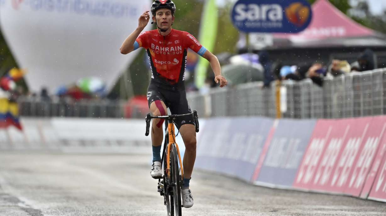 FILE - Switzerland's Gino Mader celebrates after winning the sixth stage of the Giro d'Italia cycling race, from Grotte di Frasassi to Ascoli Piceno Thursday, May 13, 2021. Swiss cyclist Gino Mader has died Friday, June 16, 2023 one day after suffering injuries when he crashed off the road down a ravine during a descent at the Tour de Suisse.