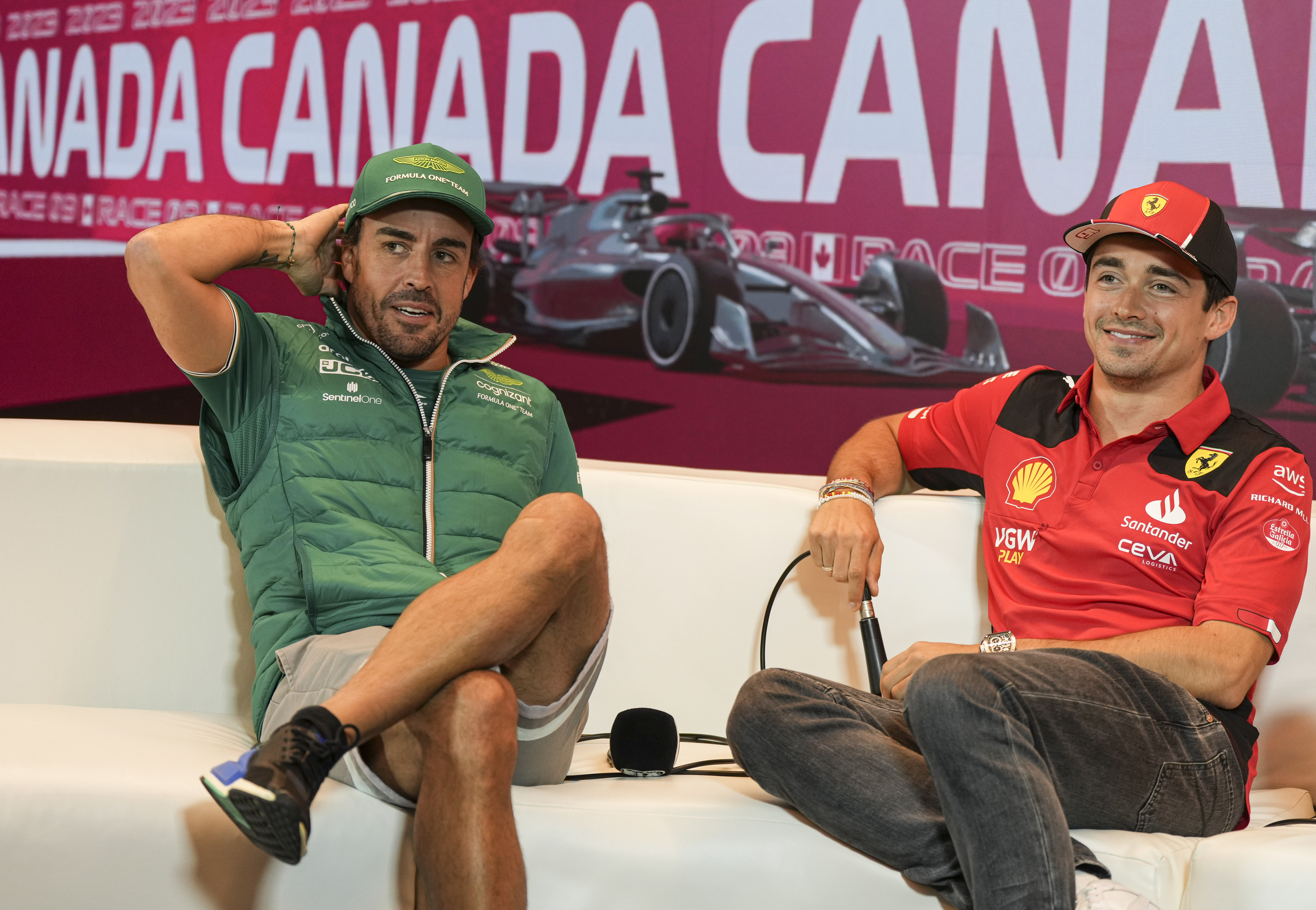 Aston Martin's Fernando Alonso, left, of Spain, and Ferrari driver Charles Leclerc, right, of Monaco, speak to the media during a news conference at the Canadian Grand Prix Formula One auto race, Thursday, June 15, 2023, in Montreal. 