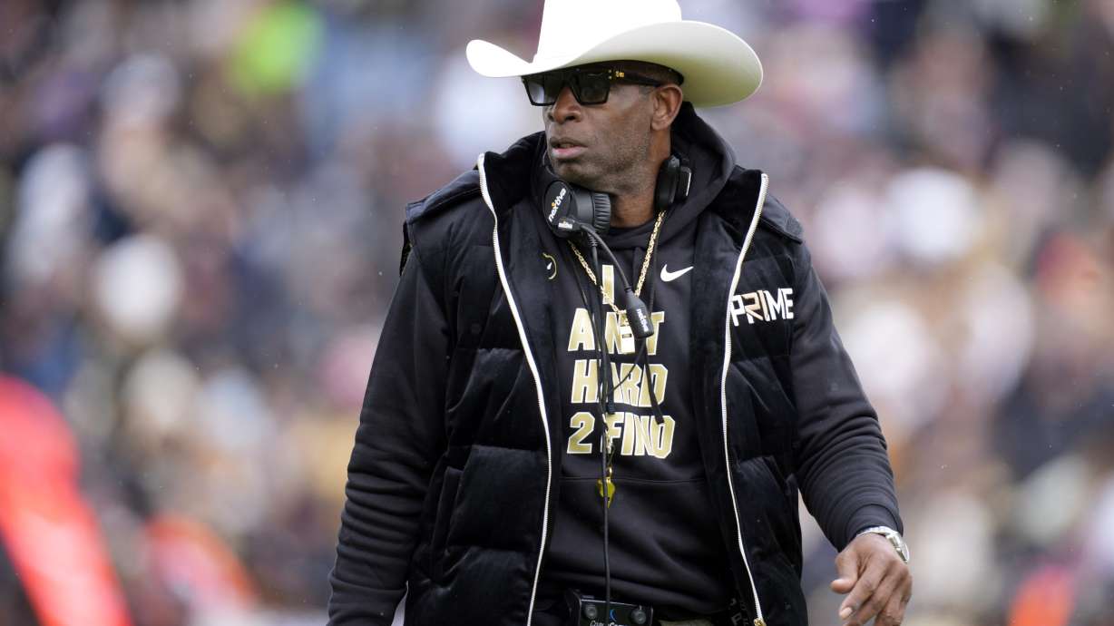 FILE - Colorado head coach Deion Sanders looks on in the first half of the team's spring practice NCAA college football game Saturday, April 22, 2023, in Boulder, Colo. Scouting and recruiting players in the NCAA transfer portal has become a vital part of building a college football program. Sanders’ team has added 20 transfers since the portal window opened April 15.