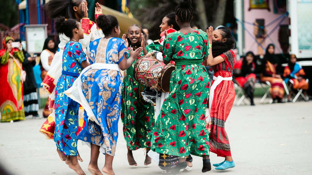 A group of refugees dance together in their cultural celebration at last year's World Refugee Event hosted by the Cache Refugee and Immigrant Connection on June 18, 2022.