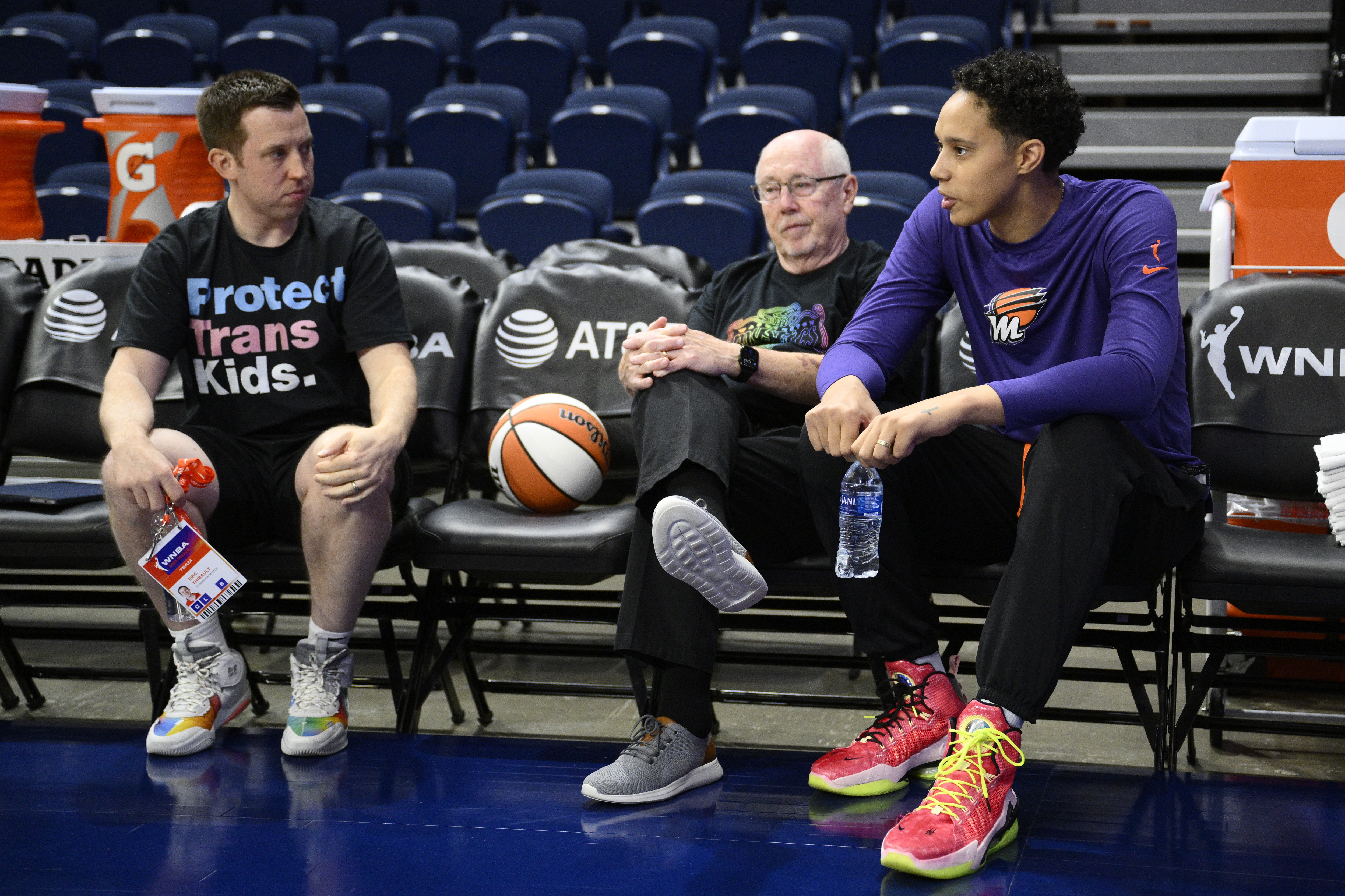 Phoenix Mercury center Brittney Griner, right, talks with Washington Mystics coach Eric Thibault, left, and general manager Mike Thibault before a WNBA basketball game Friday, June 16, 2023, in Washington.