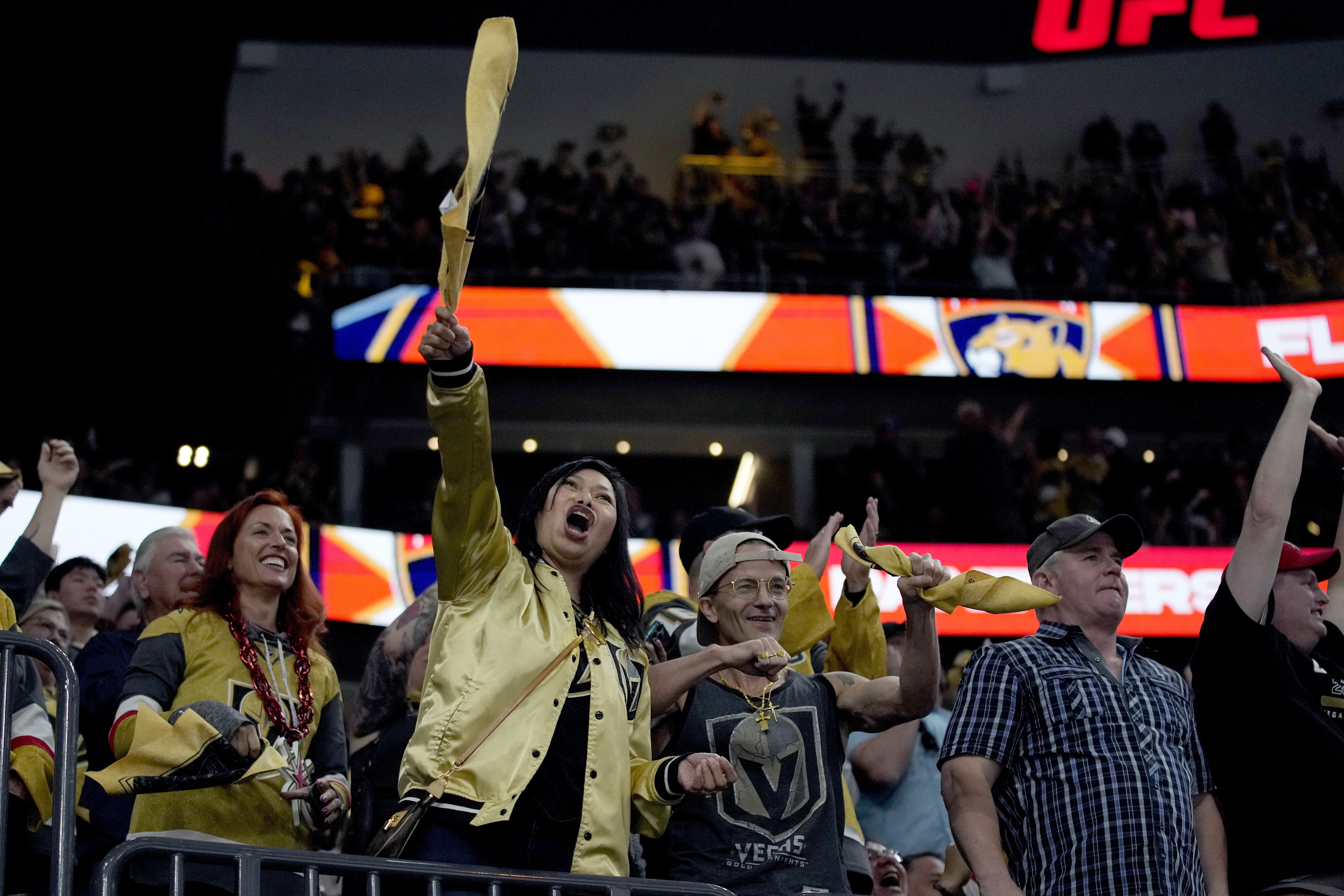 FILE - Vegas Golden Knights fans cheer after a Golden Knights goal against the Florida Panthers during the third period of Game 1 of the NHL hockey Stanley Cup Finals, June 3, 2023, in Las Vegas. The Golden Knights plan to parade this weekend with the NHL Stanley Cup beneath the glittery marquees of the Las Vegas Strip and rally with fans in front of their home arena to mark the team's league championship victory.