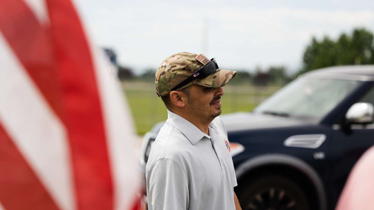 Retired U.S. Army Sergeant William Davis III laughs after receiving his new car at Ellison Park in Layton on Saturday.