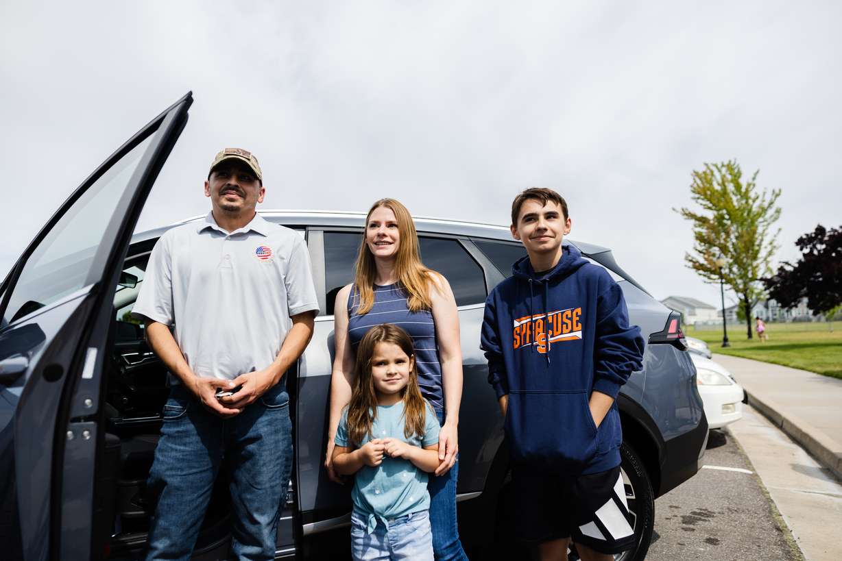 Retired U.S. Army Sgt. William Davis III stands with his wife Ashley Davis, and children, Everly, 6, and Troy, 13, at Ellison Park in Layton on Saturday.
