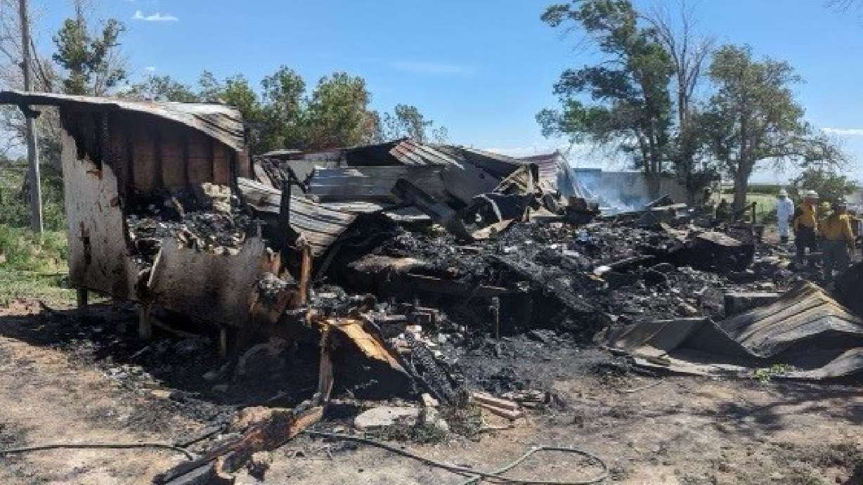 A man died in a house fire in Iron County on Sunday, authorities said, while possibly trying to save a dog.