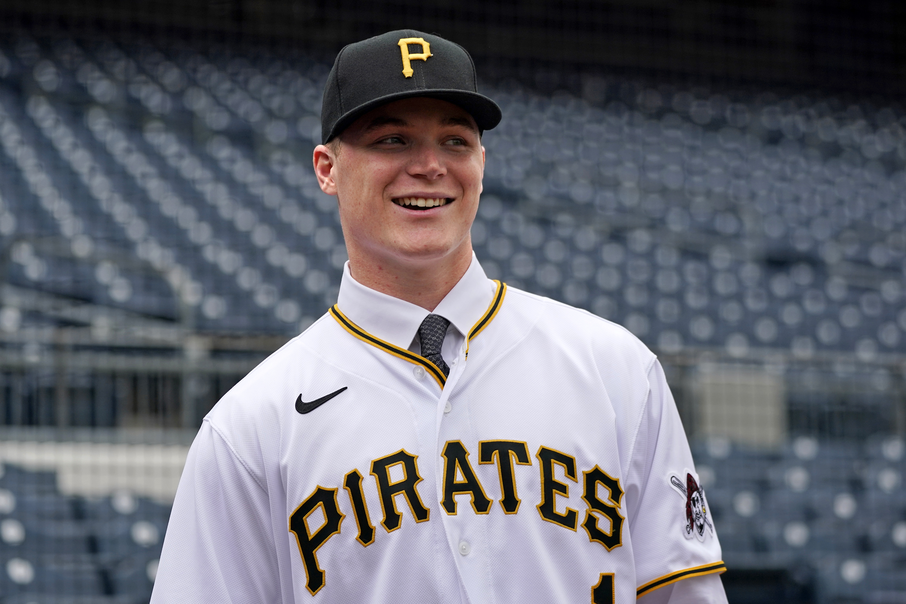 FILE - Henry Davis poses for photos on the field at PNC Park before a baseball game between the Pittsburgh Pirates and the New York Mets in Pittsburgh, July 18, 2021. The Pittsburgh Pirates are calling up heralded prospect Davis, the top pick in the 2021 draft, to help the team that has lost six straight games and tumbled from the top spot in the NL Central.