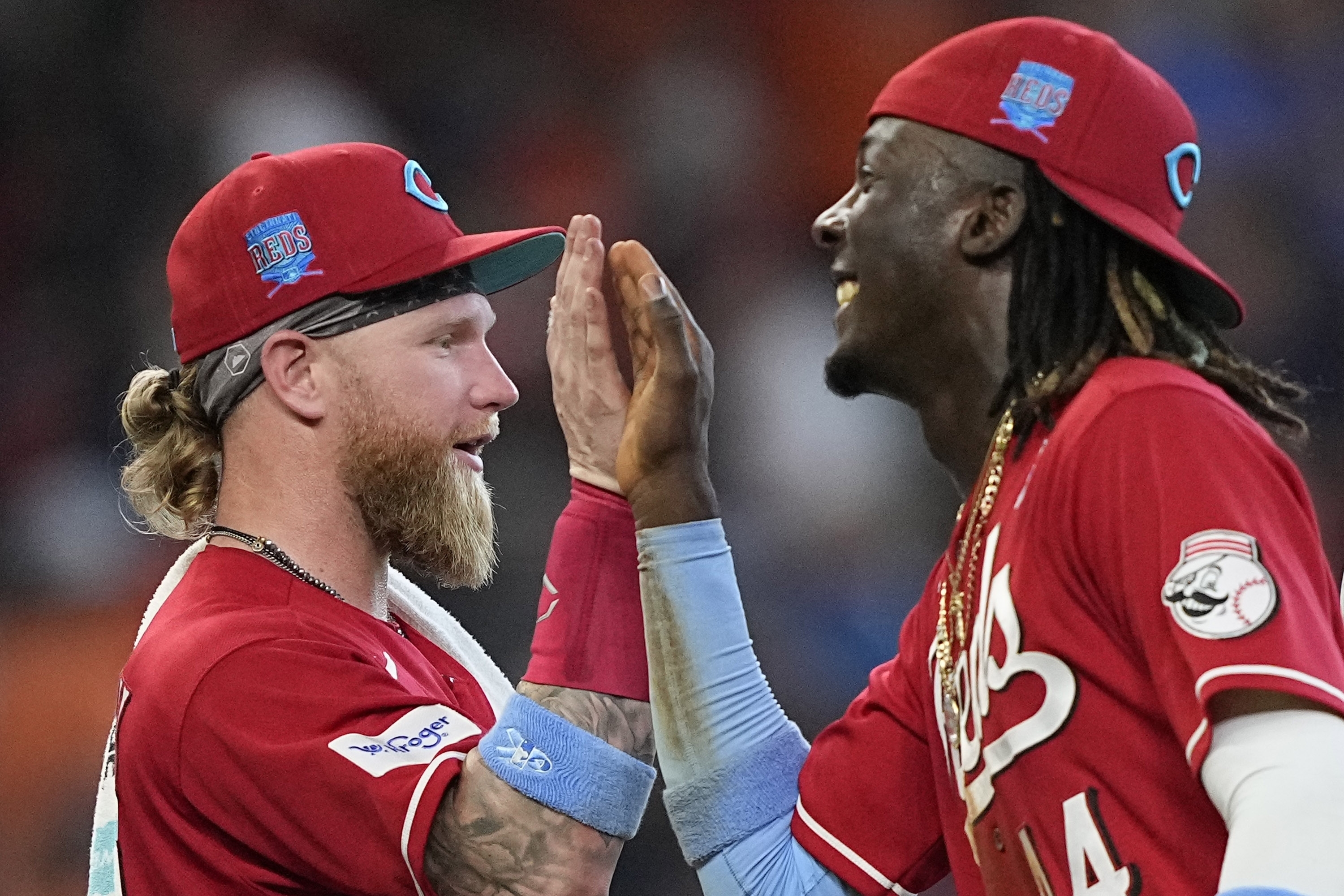 Cincinnati Reds' Elly De La Cruz (44) and Jake Fraley celebrate after a baseball game against the Houston Astros Sunday, June 18, 2023, in Houston. The Reds won 9-7 in 10 innings.
