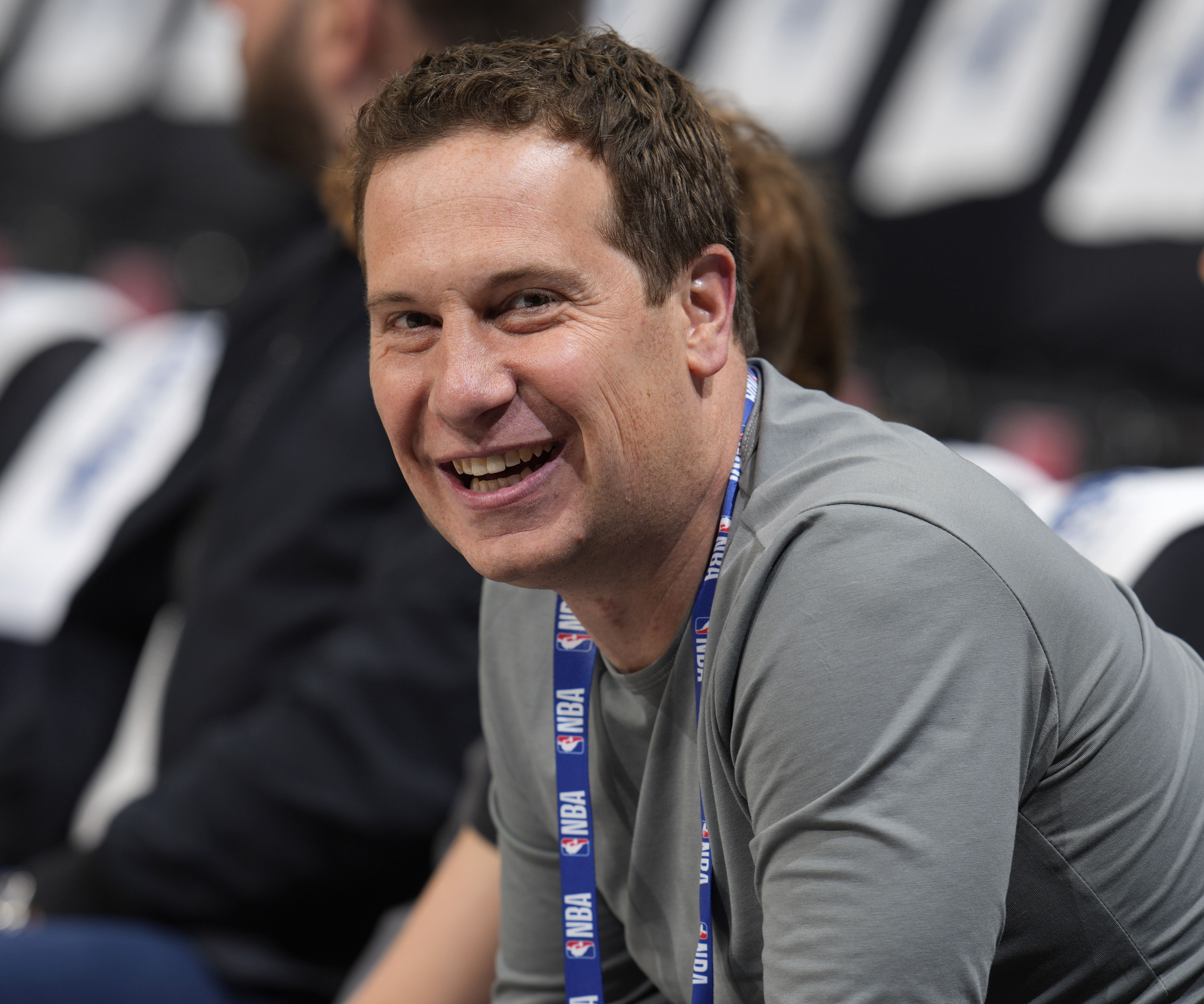 FILE - Phoenix Suns owner Mat Ishbia looks on as players warm up before Game 5 of an NBA basketball second-round playoff series against the Denver Nuggets, May 9, 2023, in Denver. Ishbia’s five-month tenure as the new owner of the Suns has produced a whirlwind of change.