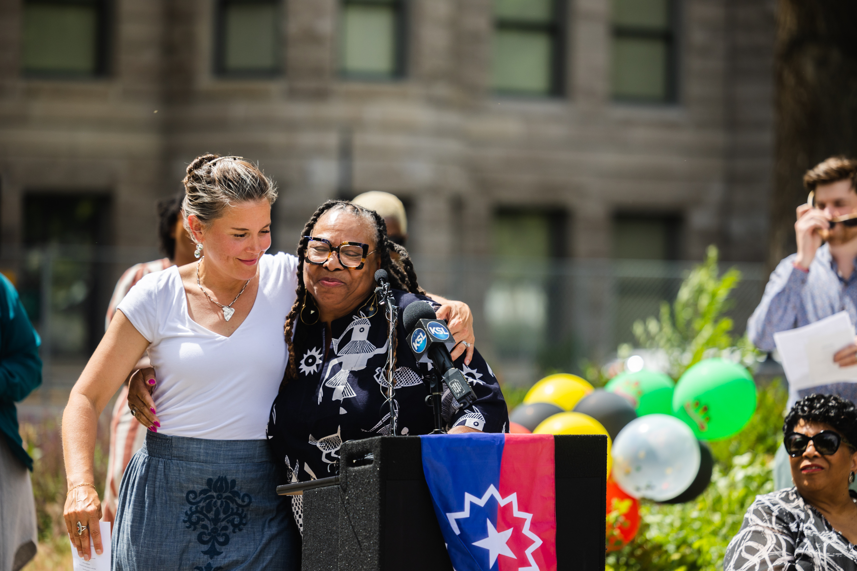 Betty Sawyer, executive director of the Project Success Coalition and Utah Juneteenth Freedom & Heritage Festival, hugs Salt Lake City Mayor Erin Mendenhall during the flag-raising ceremony for Juneteenth at the Salt Lake City-County Building on Monday.