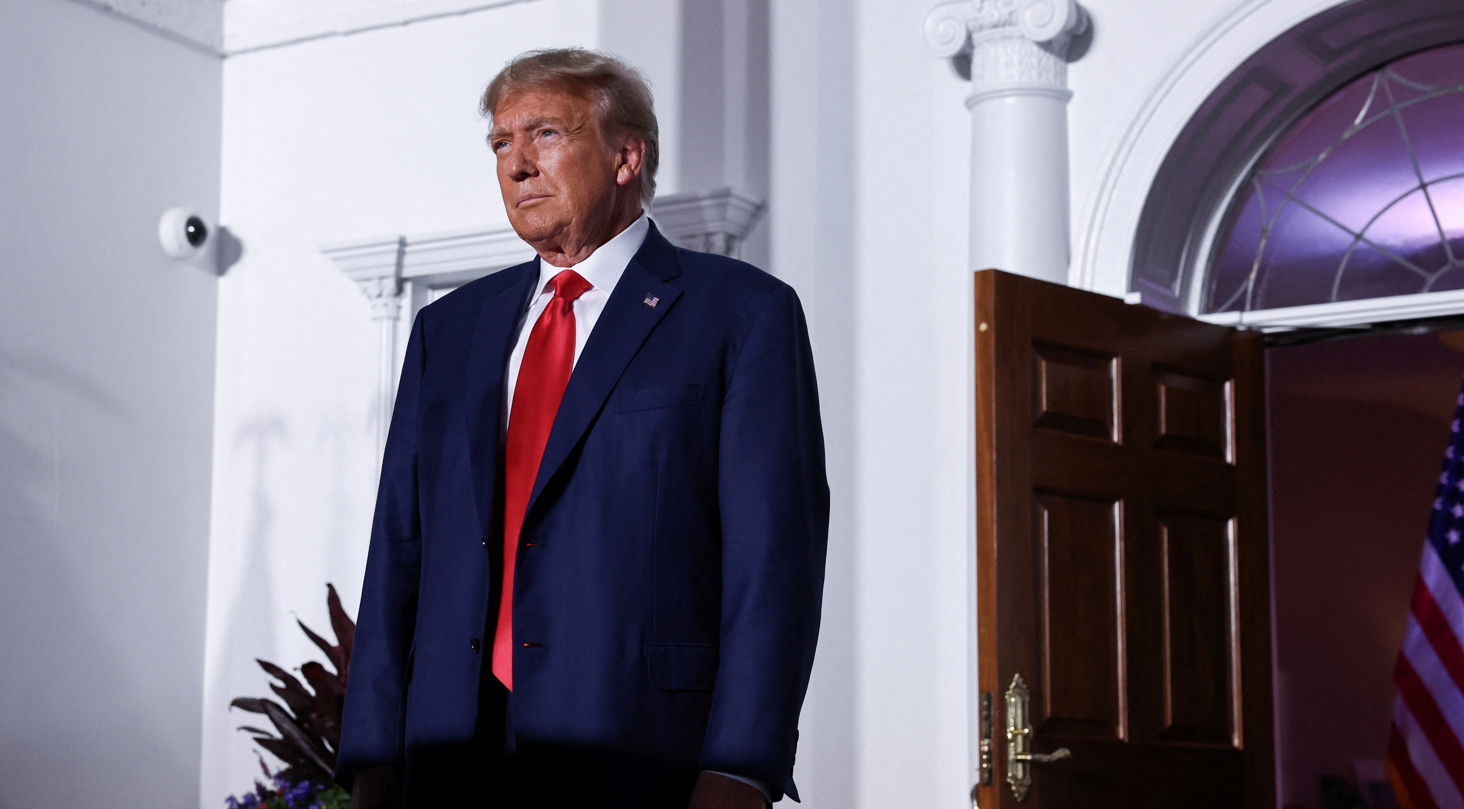 Former U.S. President Donald Trump reacts on stage following his arraignment on classified document charges, at Trump National Golf Club, in Bedminster, New Jersey, June 13.