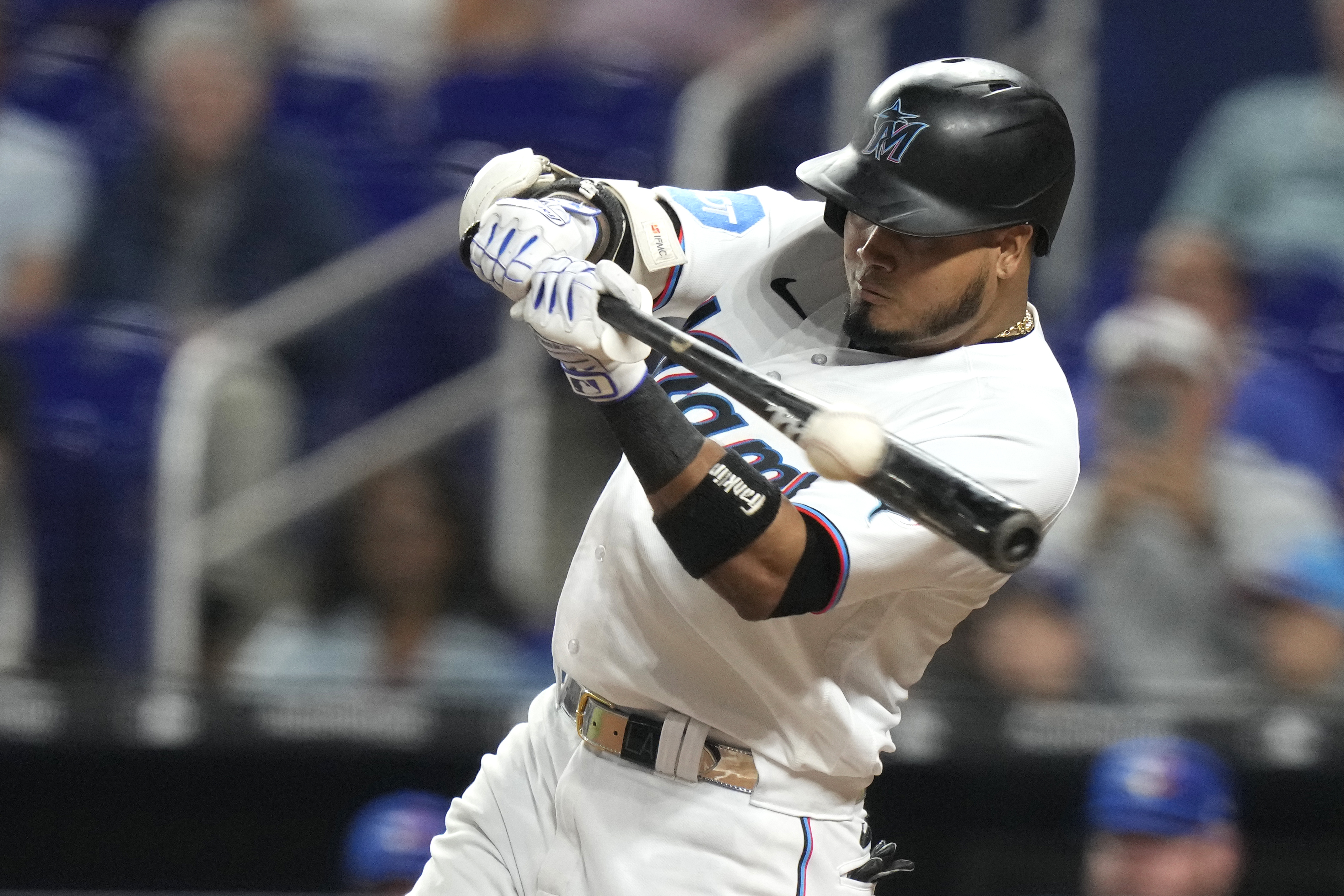 Miami Marlins' Luis Arraez hits a single during the seventh inning of a baseball game against the Toronto Blue Jays, Monday, June 19, 2023, in Miami.