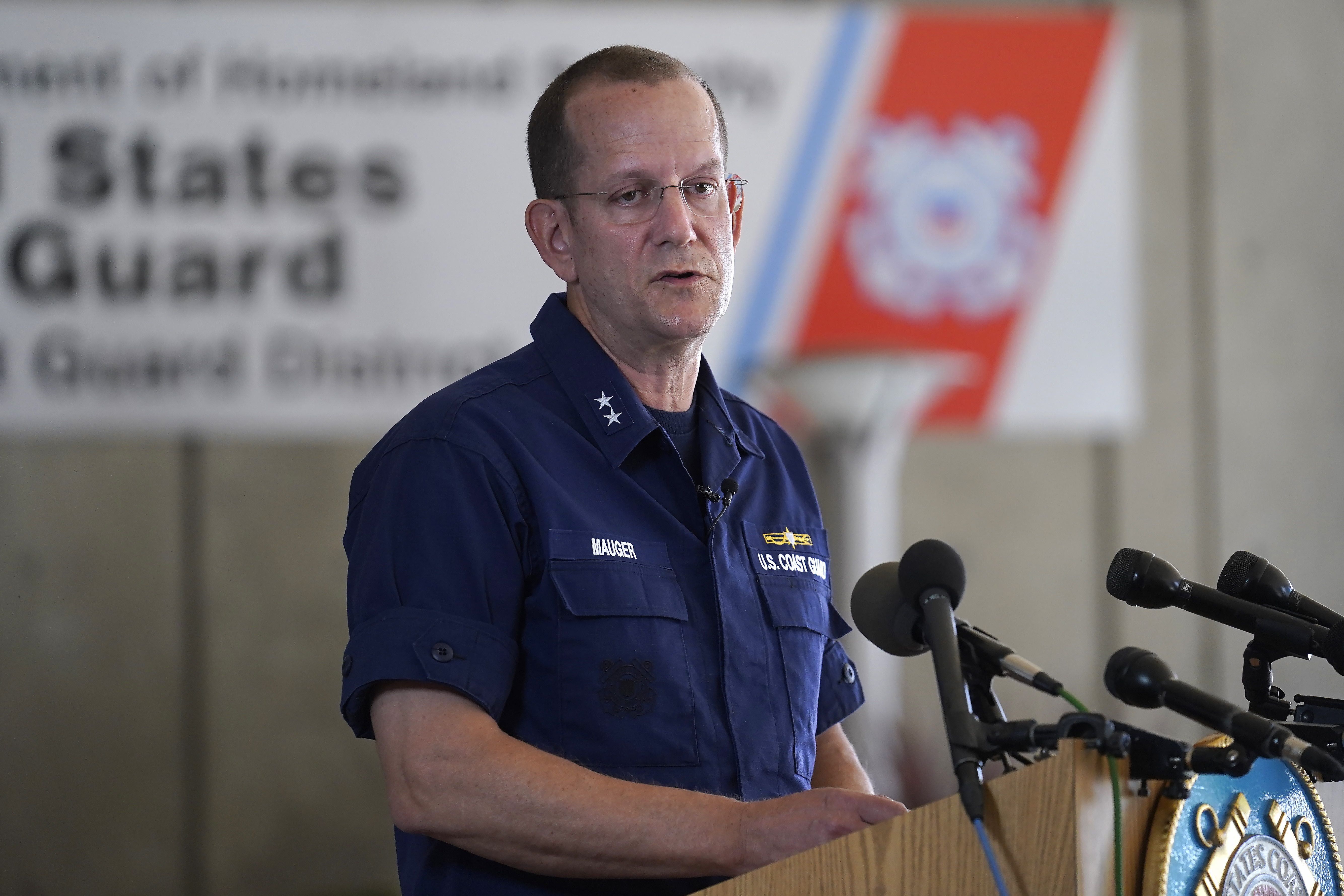 U.S. Coast Guard Rear Adm. John Mauger, commander of the First Coast Guard District, speaks to the media, Monday, in Boston. A search is underway for a missing submersible that carries people to view the wreckage of the Titanic.
