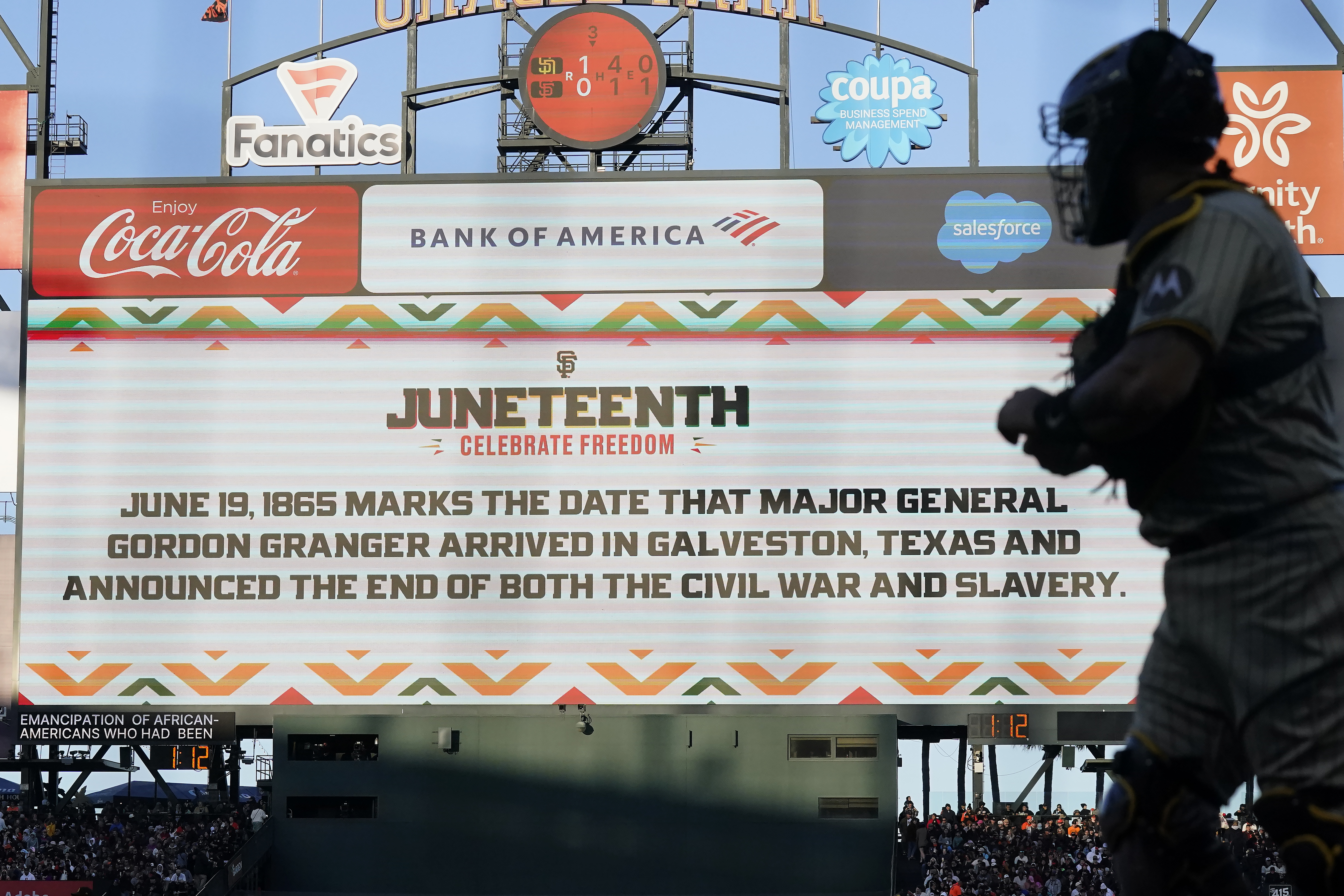 A message about the Juneteenth holiday is displayed on the videoboard during a baseball game between the San Francisco Giants and the San Diego Padres in San Francisco, Monday, June 19, 2023.