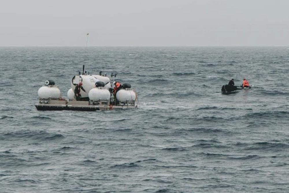 The submersible Titan is prepared for a dive into a remote area of the Atlantic Ocean on an expedition to the Titanic on Sunday. Rescuers raced against time Tuesday to find the missing submersible carrying five people, who were reported overdue Sunday night.