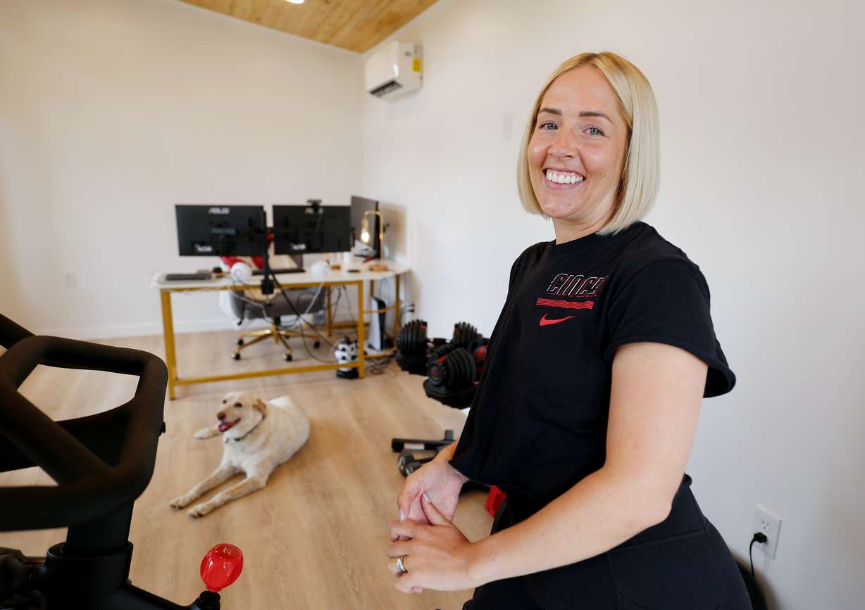 Homeowner Sydney Jones poses for a photo while inside her newly completed office space in her backyard on June 20, in Midvale.