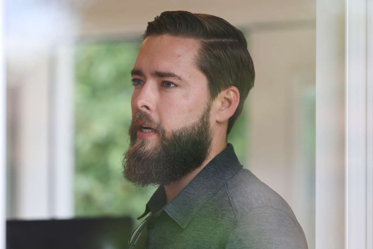 Jonathan Hitzhusen, owner of Backyard Office Utah, talks about his small business while standing in the new office space in the yard of client Sydney Jones on June 20.