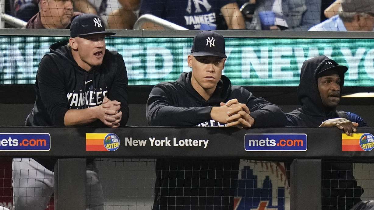 New York Yankees Aaron Judge, center, watches with teammates during the ninth inning of a baseball game against the New York Mets Tuesday, June 13, 2023, in New York. The Yankees won 7-6.