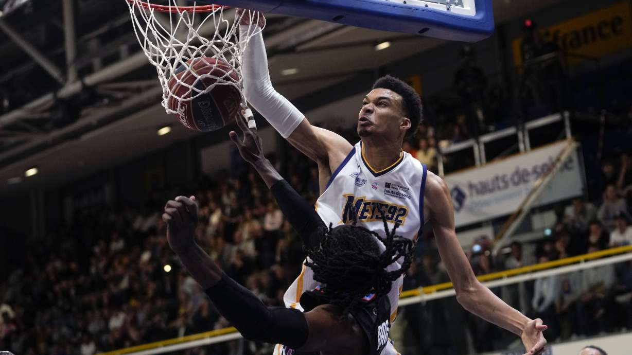 FILE - Boulogne-Levallois' Victor Wembanyama, top, dunks during the Elite basketball match Boulogne-Levallois against Paris at the Palais de Sports Marcel Cerdan stadium in Levallois-Perret, outside Paris, May 16, 2023. Wembanyam is among the headliners among the top big men in the upcoming NBA draft.
