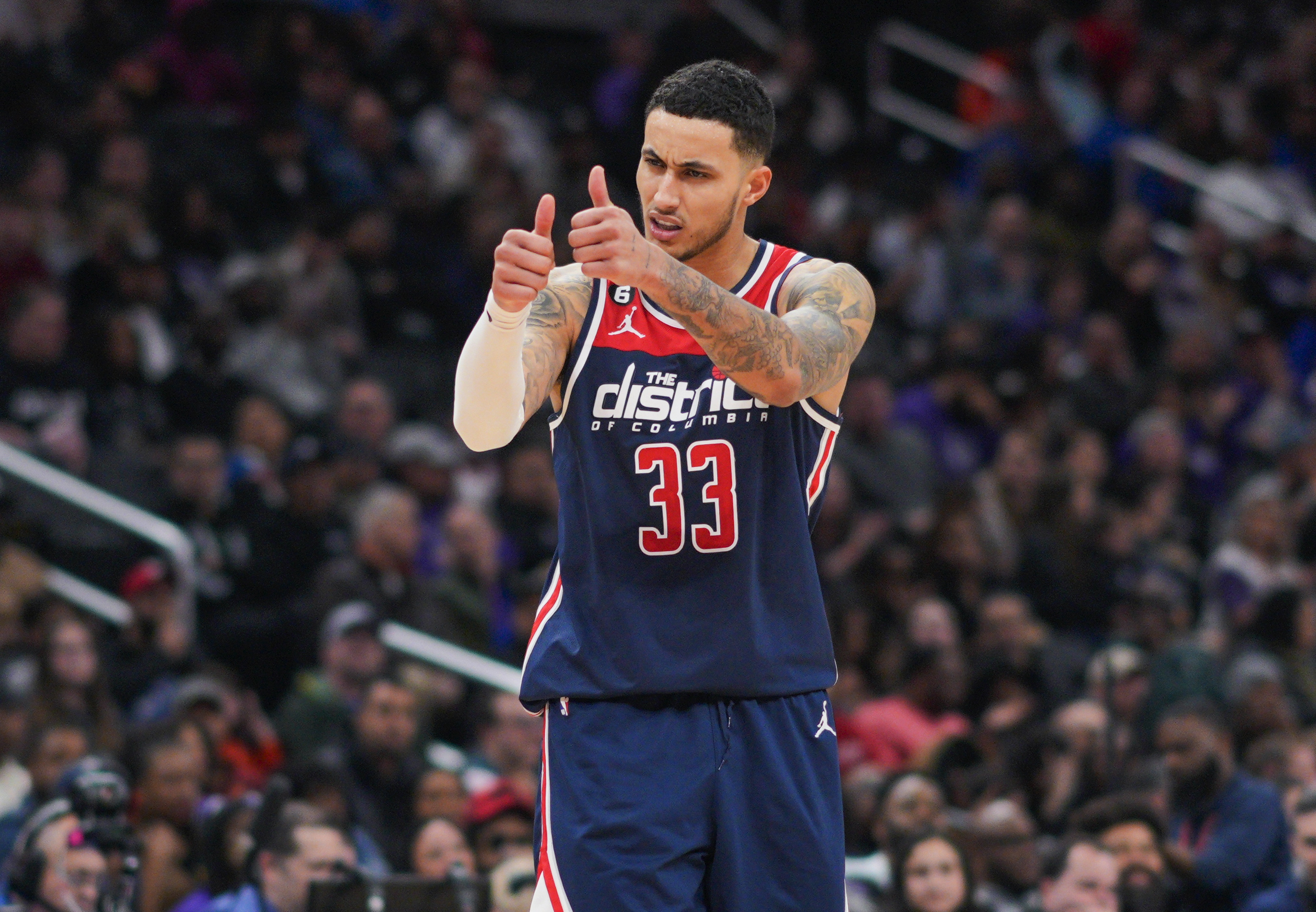 FILE - Washington Wizards forward Kyle Kuzma gestures to teammates during the second half of an NBA basketball game against the Sacramento Kings on March 18, 2023, in Washington. Kuzma will be a free agent when the league's annual offseason shopping period starts next week. Kuzma has declined his $13 million player option with the Wizards for next season, a person with knowledge of his decision said Tuesday, June 20, 2023, meaning he will be a free agent. The person spoke to The Associated Press on condition of anonymity because neither side disclosed the move. 