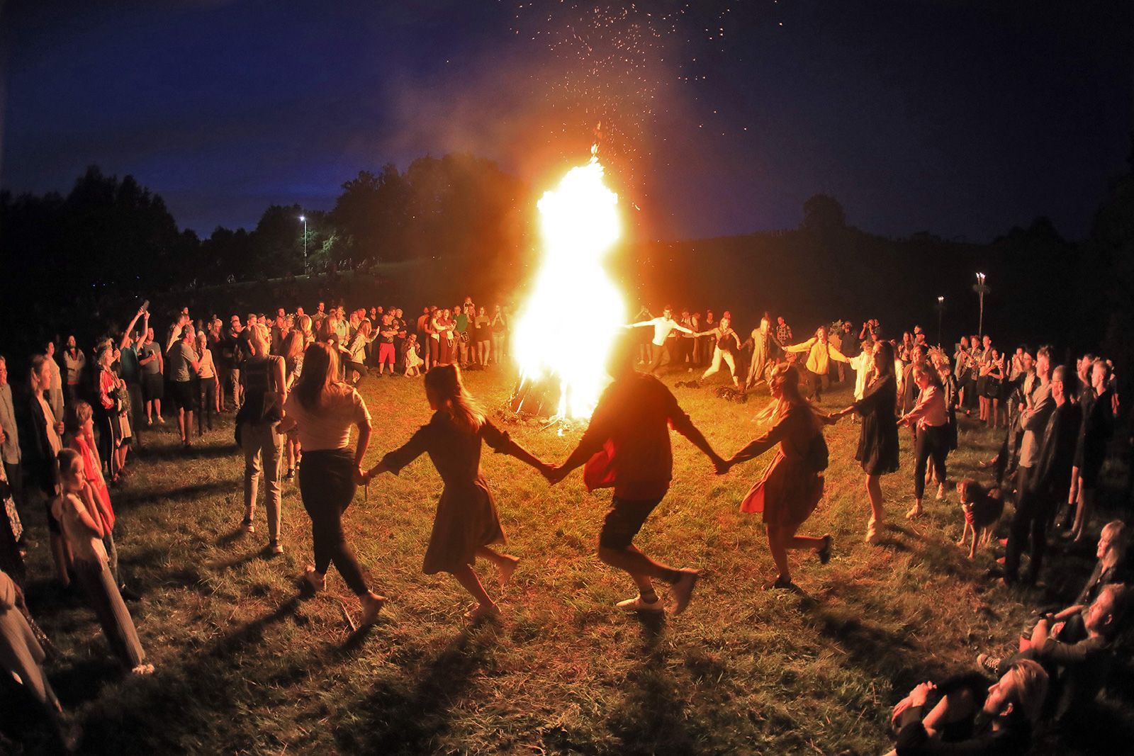 People take part in a traditional Rasos midsummer celebration, which has pagan roots, in Lithuania on June 23, 2020. Wednesday marks the summer solstice for the Northern Hemisphere.