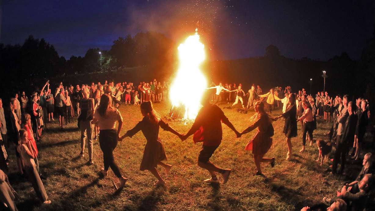 People take part in a traditional Rasos midsummer celebration, which has pagan roots, in Lithuania on June 23, 2020. Wednesday marks the summer solstice for the Northern Hemisphere.