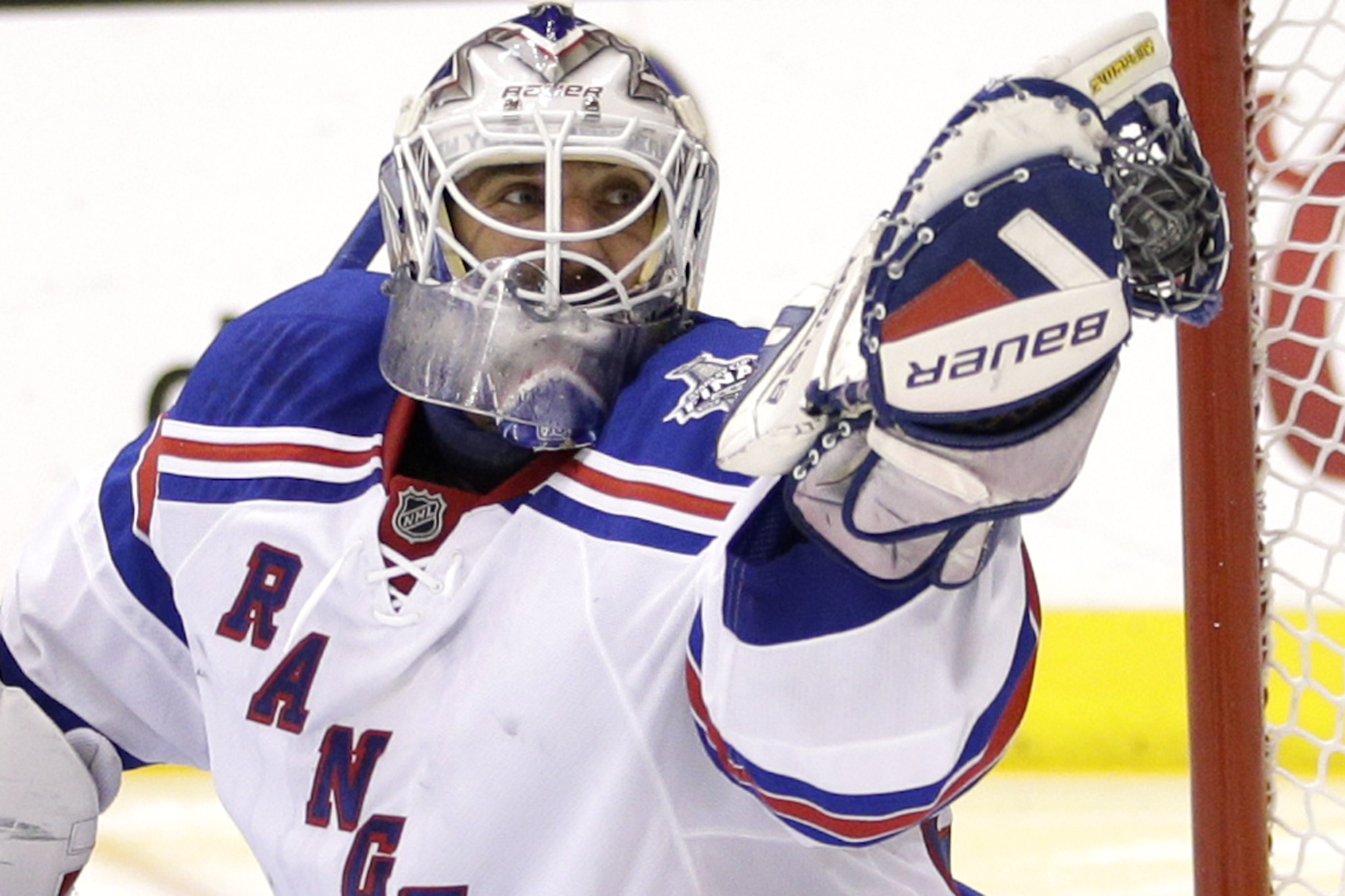 FILE - New York Rangers goalie Henrik Lundqvist, of Sweden, gloves the puck while playing against the Los Angeles Kings during the second period in Game 5 of the NHL Stanley Cup Final series in Los Angeles, June 13, 2014. Henrik Lundqvist is expected to be elected to the Hockey Hall of Fame in his first year of eligibility. 