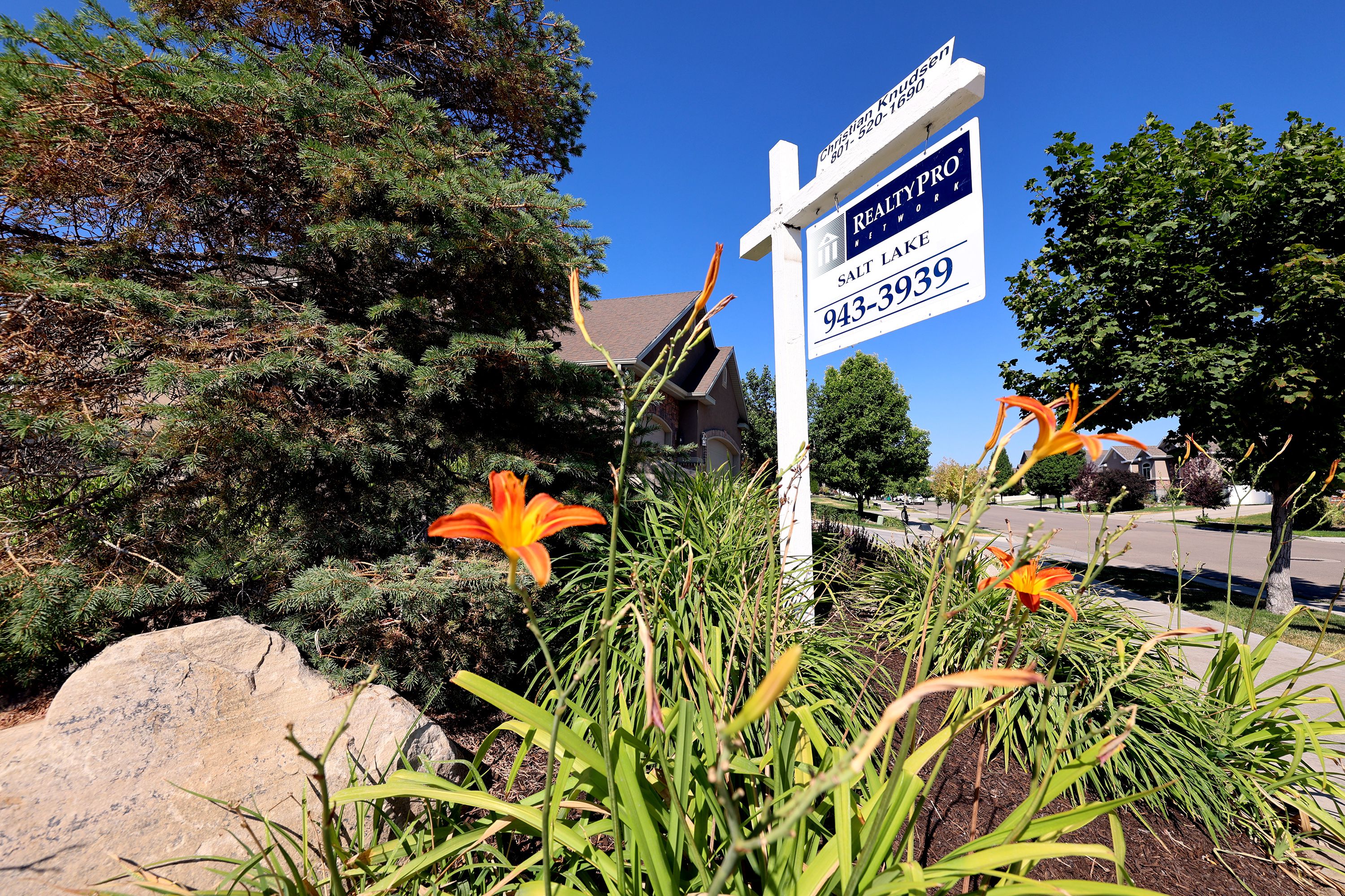 A home for sale sign is pictured in the Salt Lake Valley on July 16, 2021. The Salt Lake City metro area continues to be among the top housing markets in the U.S. to see the most dramatic declines in home sales; however, home sales also appear to be picking up steam heading into the summer.