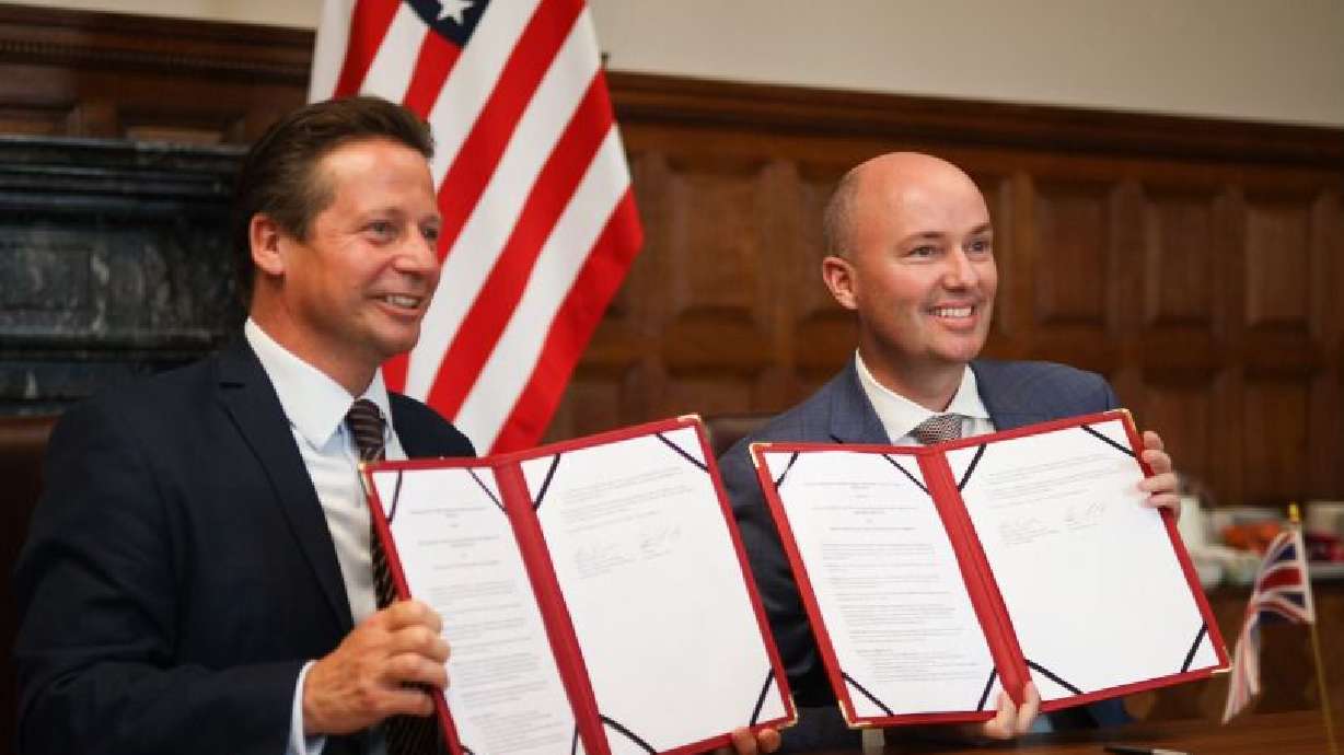 Utah Gov. Spencer J. Cox poses for a photo with the United Kingdom’s Trade Minister Nigel Huddleston on Thursday after signing a memorandum to encourage trade and investment with the United Kingdom.