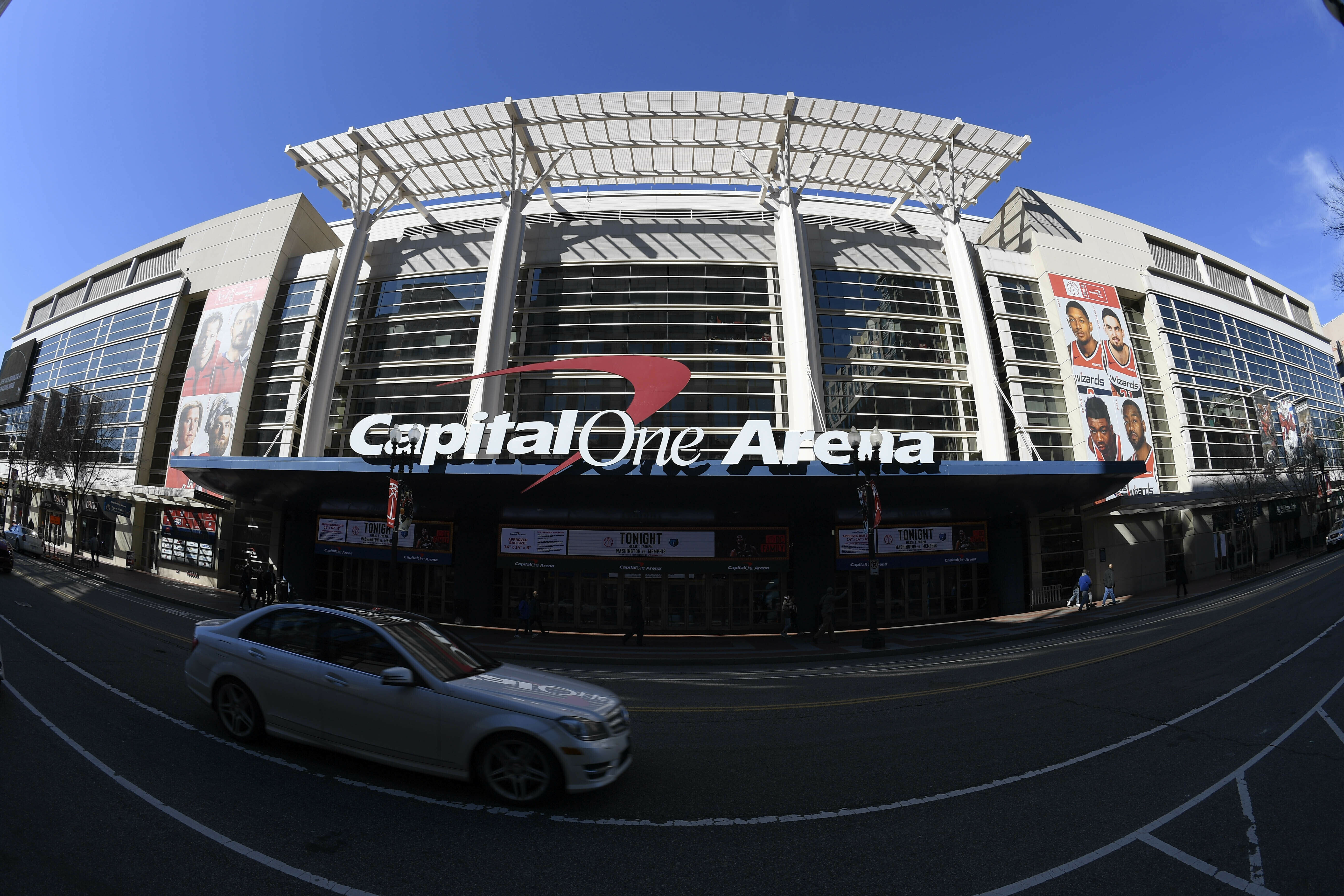 FILE - An exterior view of Capital One Arena is seen Saturday, March 16, 2019, in Washington. Capital One Arena is home to the Washington Capitals NHL hockey team and Washington Wizards NBA basketball team. A person with knowledge of the sale tells The Associated Press the Qatar Investment Authority is buying a 5% stake of the parent company of the NBA's Washington Wizards and NHL's Washington Capitals for $4.05 billion. It is believed to be the first time the government of Qatar is investing in North American professional sports. 