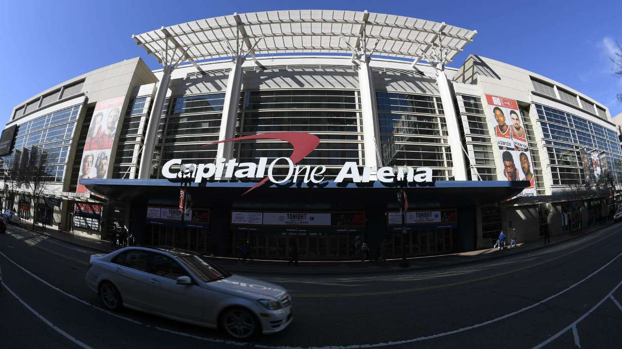 FILE - An exterior view of Capital One Arena is seen Saturday, March 16, 2019, in Washington. Capital One Arena is home to the Washington Capitals NHL hockey team and Washington Wizards NBA basketball team. A person with knowledge of the sale tells The Associated Press the Qatar Investment Authority is buying a 5% stake of the parent company of the NBA's Washington Wizards and NHL's Washington Capitals for $4.05 billion. It is believed to be the first time the government of Qatar is investing in North American professional sports.