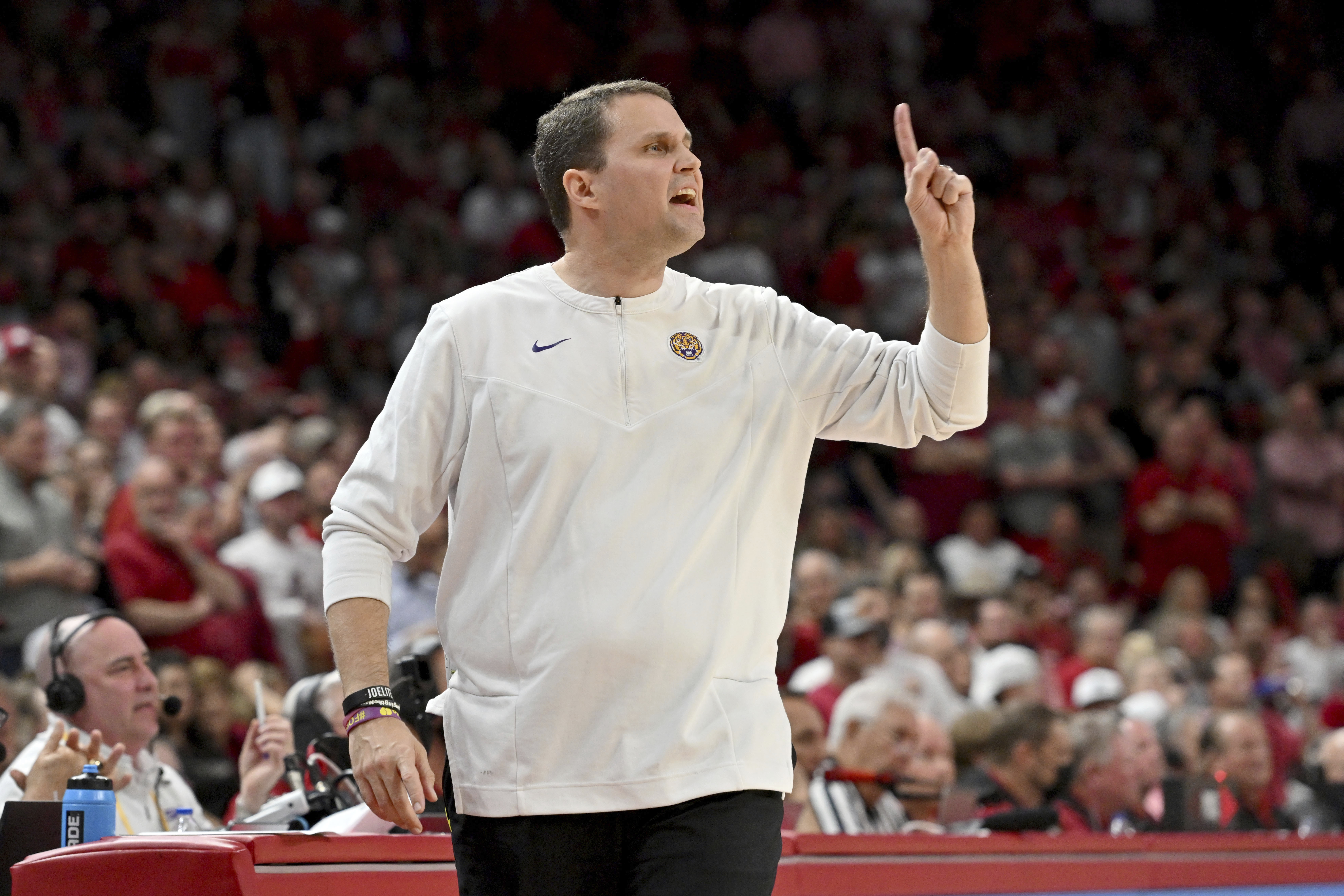 FILE - Then-LSU coach Will Wade gestures during the first half of an NCAA college basketball game against Arkansas, Wednesday, March 2, 2022, in Fayetteville, Ark. An independent infractions panel handed a two-year show-cause penalty and a 10-game suspension to former LSU and current McNeese State men's basketball coach Will Wade on Thursday, June 22, 2023, for multiple rules violations. 