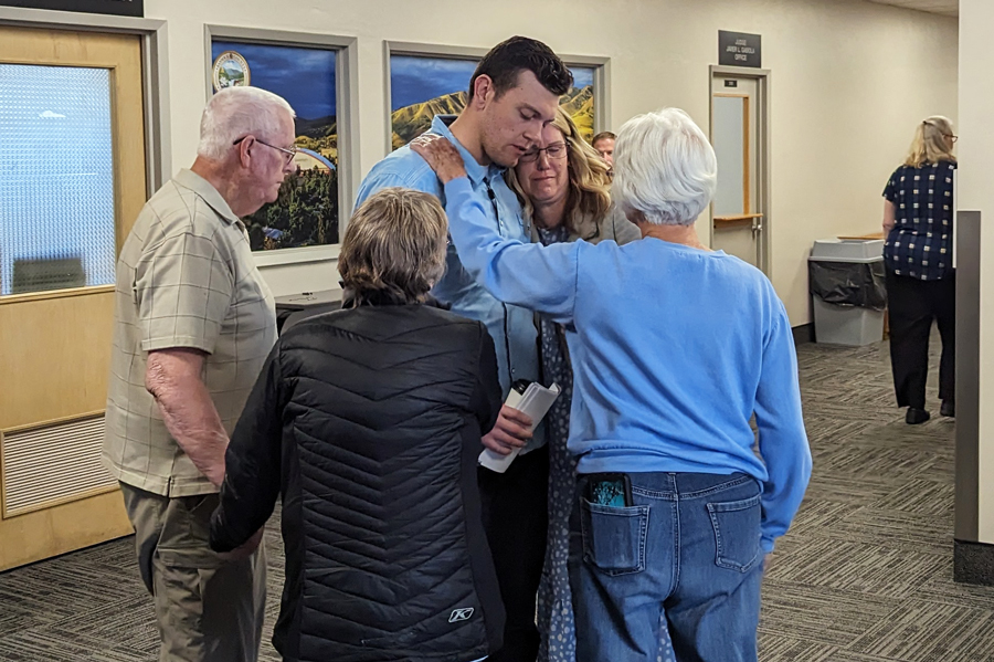 Jared Goody is comforted by loved ones following the hearing. Courtney Goody pleaded guilty to two counts of misdemeanor battery for poisoning her then-husband in 2020.