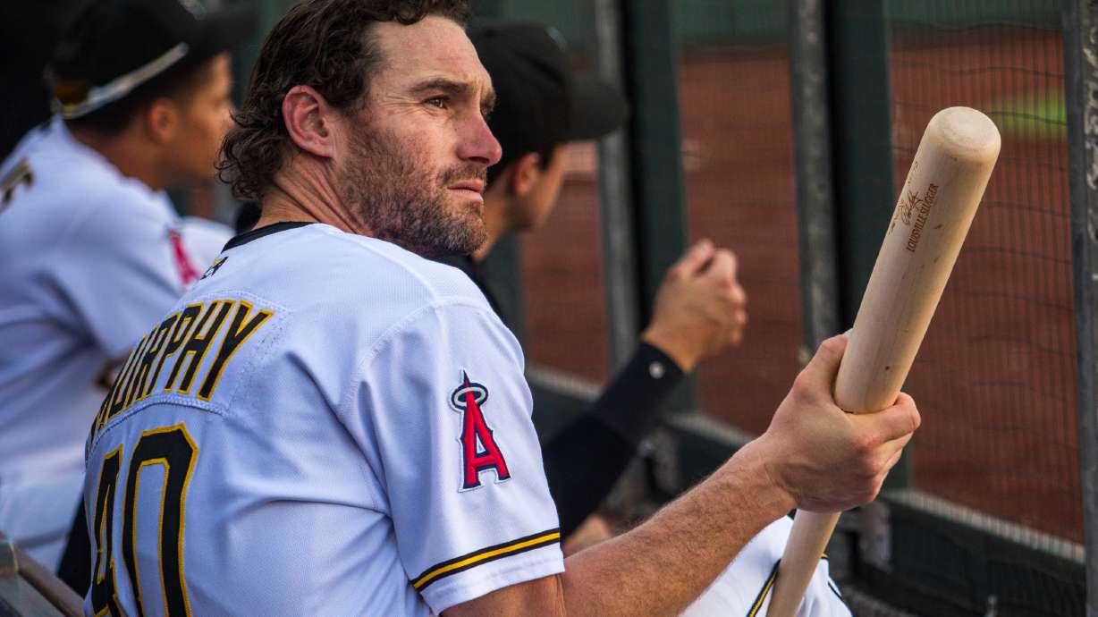 Salt Lake Bees infielder Daniel Murphy sits with his bat in the dugout of Smith's Ballpark during a game against the Sugar Land Space Cowboys on June 22, 2023. Murphy is one of the participants listed in this year's Home Run Derby X series, coming to Utah in September.