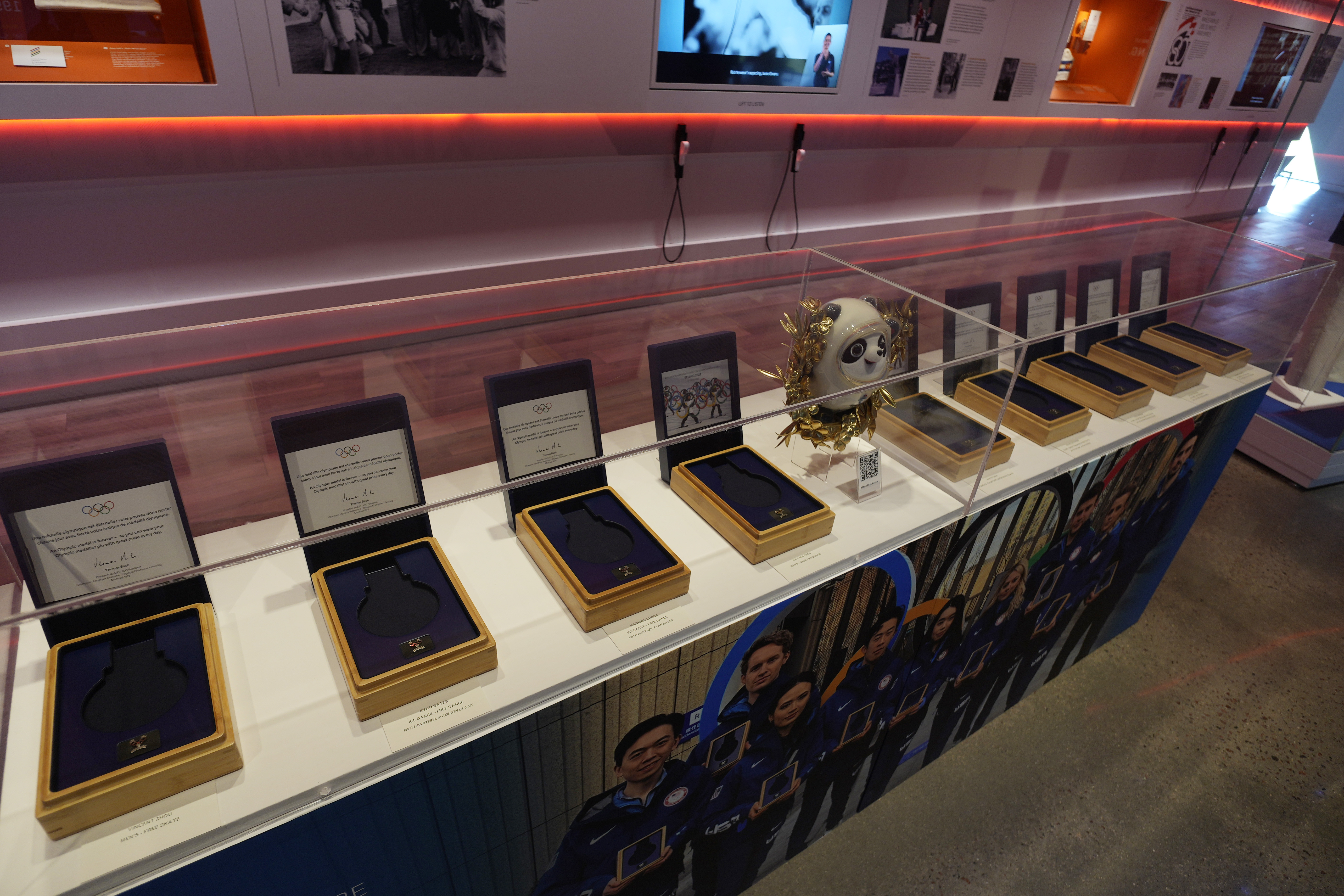 Nine empty boxes, which belong to members of the U.S. figure skating team who finished in second place last year in the Winter Olympics in Beijing, sit in a display case in the U.S. Olympic and Paralympic Museum on Thursday, June 22, 2023, in Colorado Springs, Colo. The figure skaters have not received their medals while a doping case involving a Russian skater plays out. 