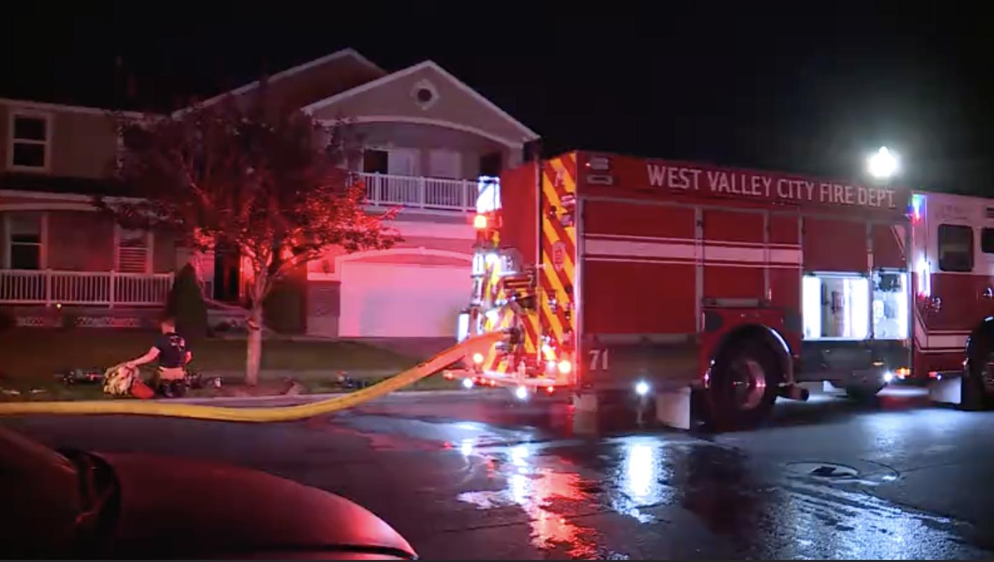 A family safely evacuated from their burning home in West Valley City early Friday.