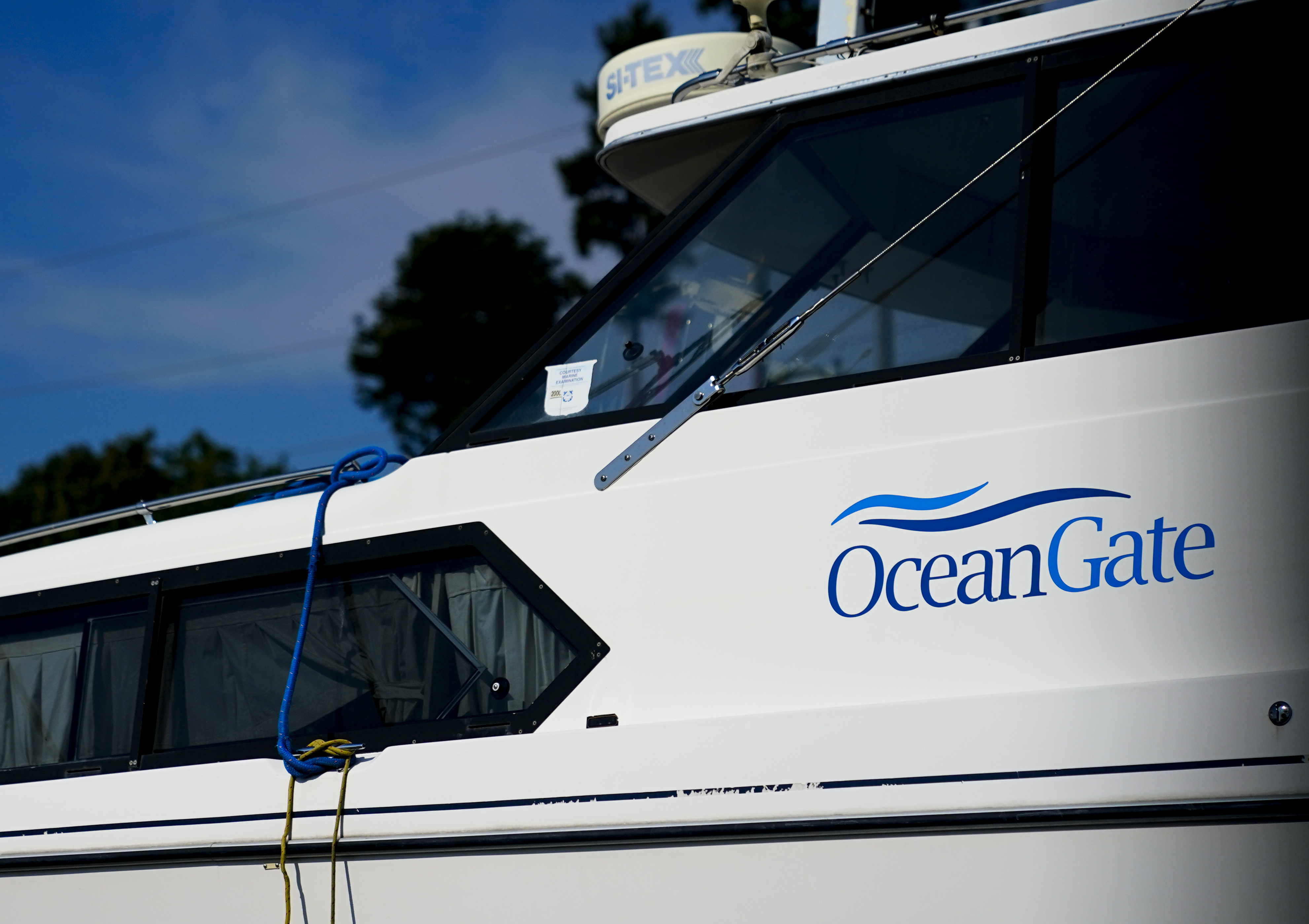 A boat with the OceanGate logo is parked on a lot near the OceanGate offices Thursday in Everett, Wash. The U.S. Coast Guard said Thursday that the missing submersible Titan imploded near the Titanic shipwreck site, killing everyone on board.