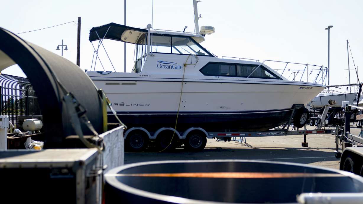 A boat with the OceanGate logo is parked on a lot near the OceanGate offices Thursday in Everett, Wash. The U.S. Coast Guard said Thursday that the missing submersible Titan imploded near the Titanic shipwreck site, killing everyone on board.