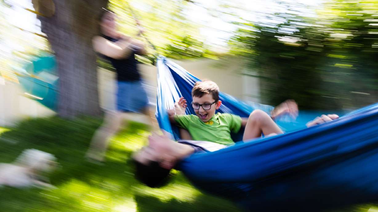 Emily Perl plays with her children, Liam, 12, and Thomas, 10, in the backyard of her home in Orem on Wednesday. The family has found that the newfound freedom children get as the final bell for the school year rings can be difficult, especially for kids with attention-deficit/hyperactivity disorder, or ADHD.