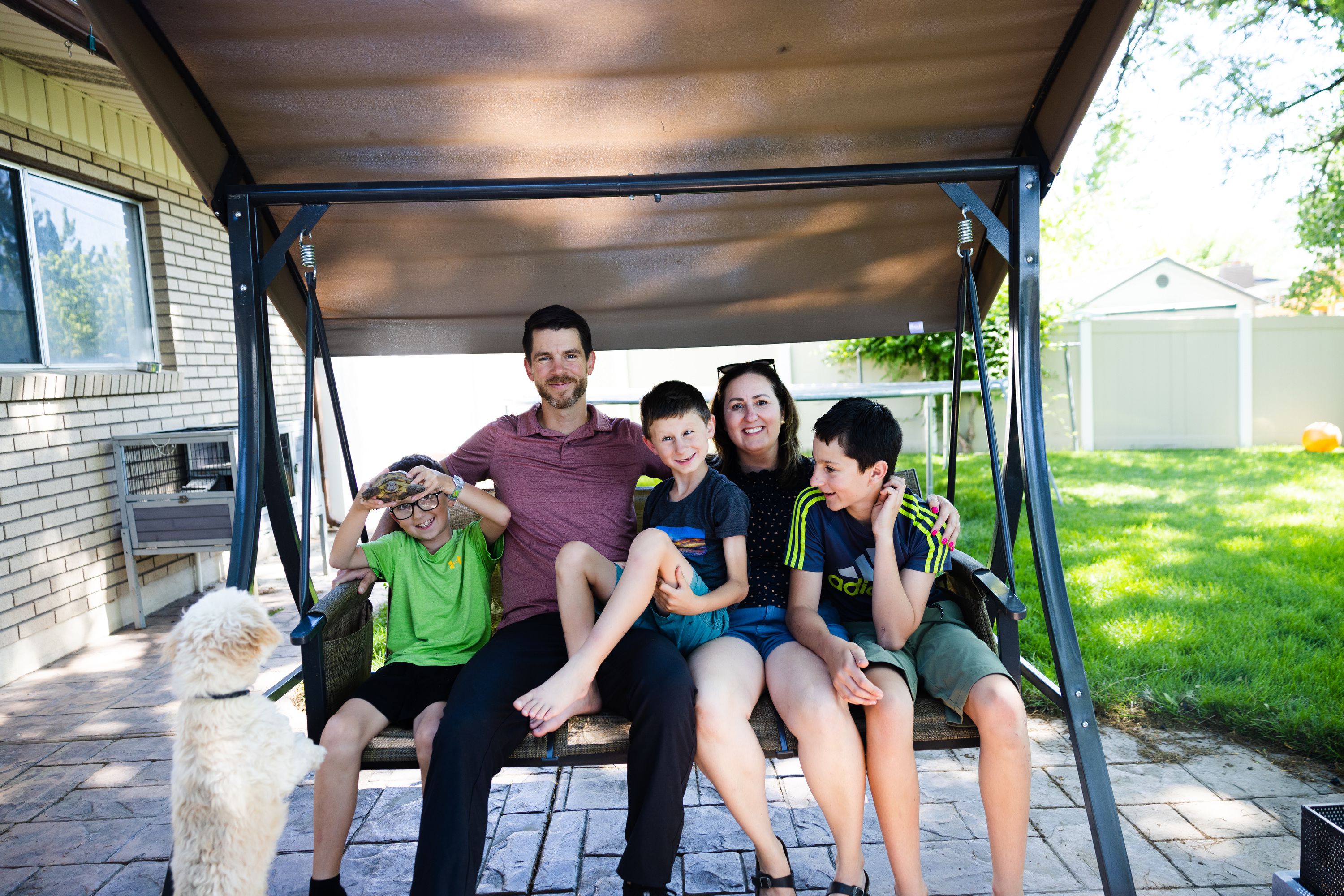 Alan and Emily Perl pose for a portrait with their children, Liam, 12, Thomas, 10, and Eddie, 7, in the backyard of their home in Orem on Wednesay.