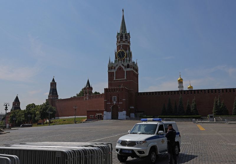 A police officer guards the closed Red Square in Moscow, Russia, Sunday. The unprecedented challenge to Russian President Vladimir Putin this weekend exposed fresh "cracks" in the strength of his leadership that may take weeks or months to play out, U.S. Secretary of State Antony Blinken said on Sunday.