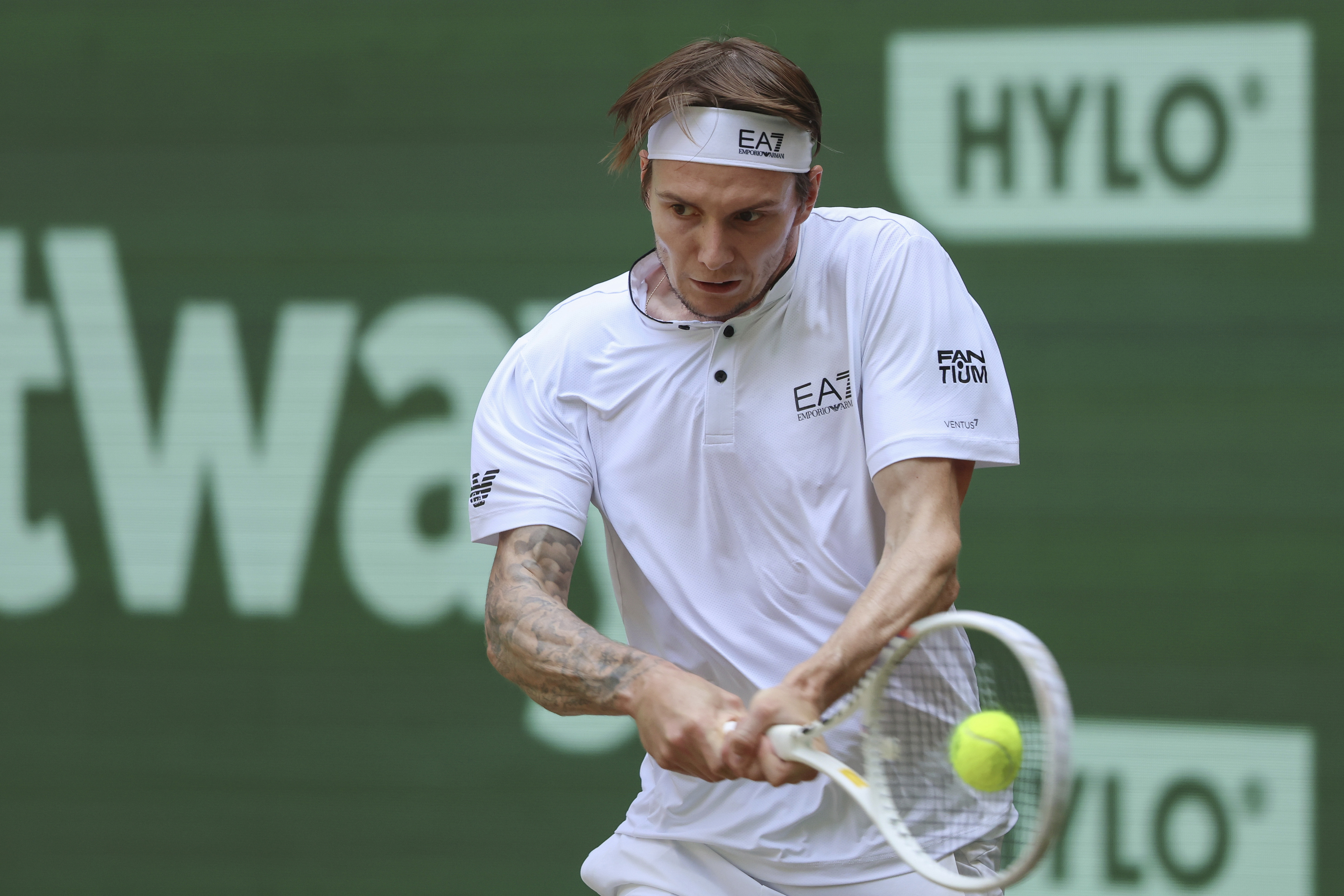 Kazakhstan's Alexander Bublik returns the ball to Russia's Andrey Rublev during their final match at the German Tennis Open, in Halle, Sunday, June 25, 2023. 