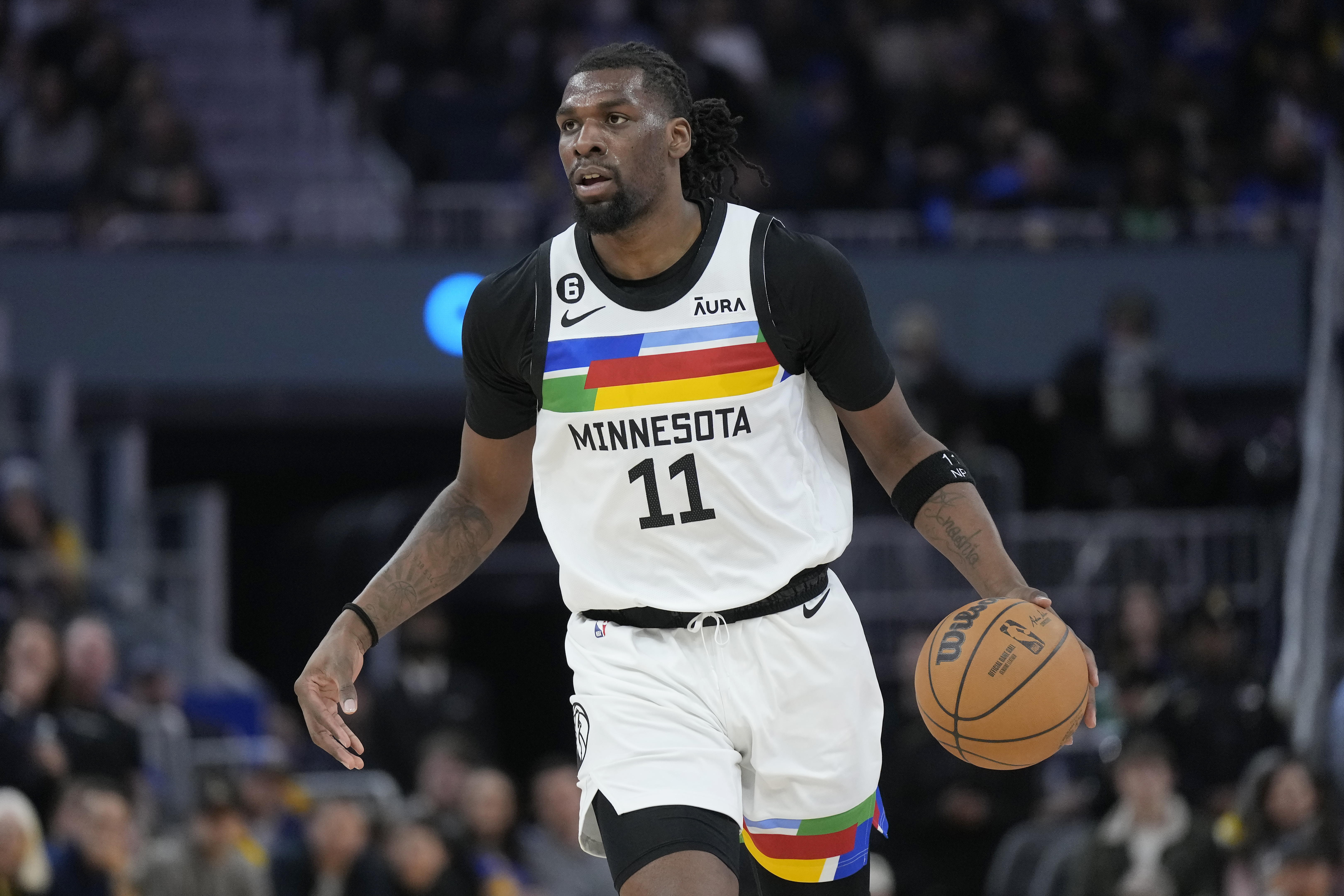 FILE - Minnesota Timberwolves center Naz Reid (11) plays an NBA basketball game against the Golden State Warriors in San Francisco, Sunday, Feb. 26, 2023. The Timberwolves have kept backup center Naz Reid off the market by agreeing to terms on a three-year, $42 million contract Sunday night, June 25, that comes with a player option after two seasons. 